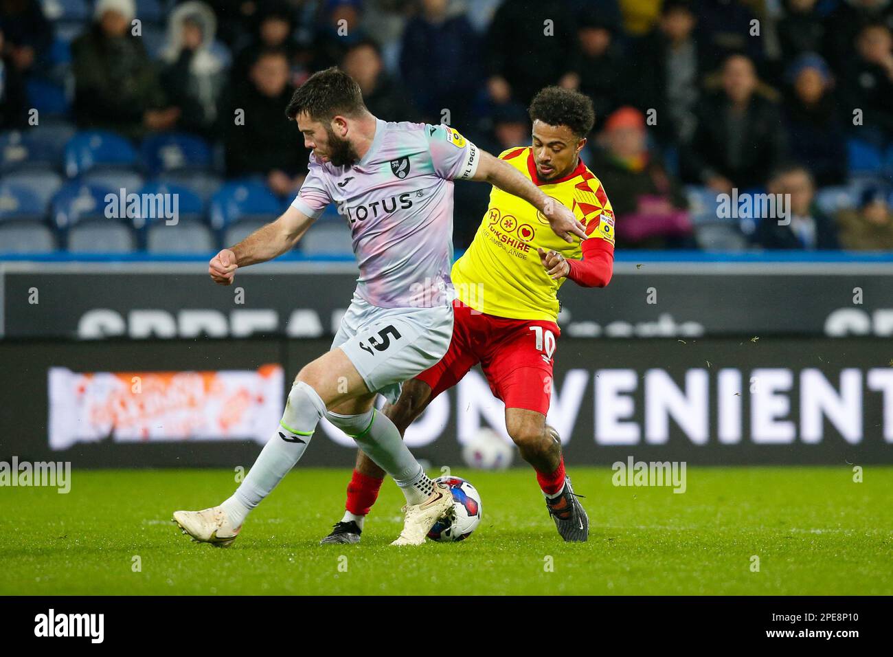 Huddersfield, UK. 15th Mar, 2023. Josh Koroma #10 of Huddersfield Town and Grant Hanley #5 of Norwich City during the Sky Bet Championship match Huddersfield Town vs Norwich City at John Smith's Stadium, Huddersfield, United Kingdom, 15th March 2023 (Photo by Ben Early/News Images) Credit: News Images LTD/Alamy Live News Stock Photo