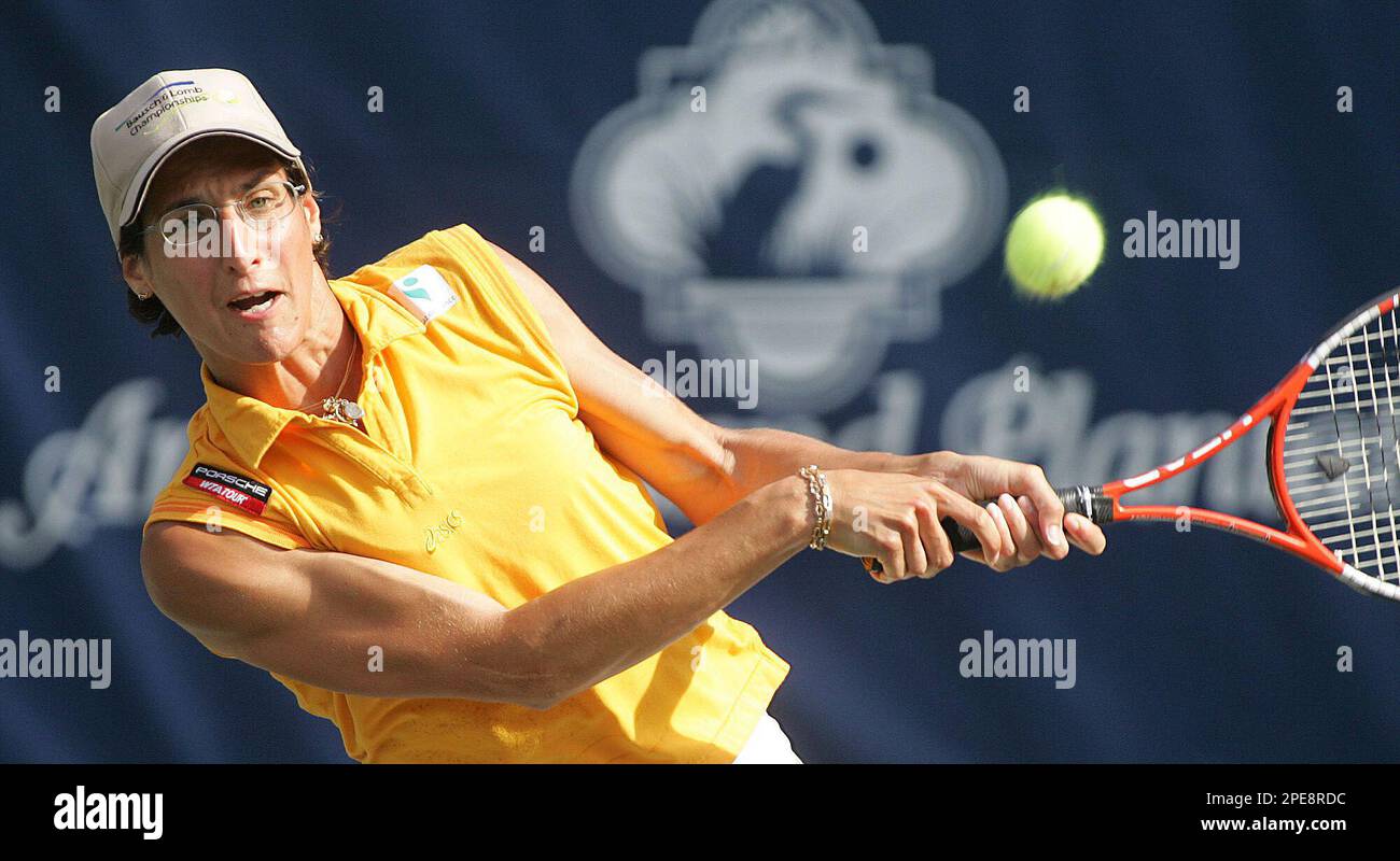Virginie Razzano, of France, returns a shot to Alicia Molik during
