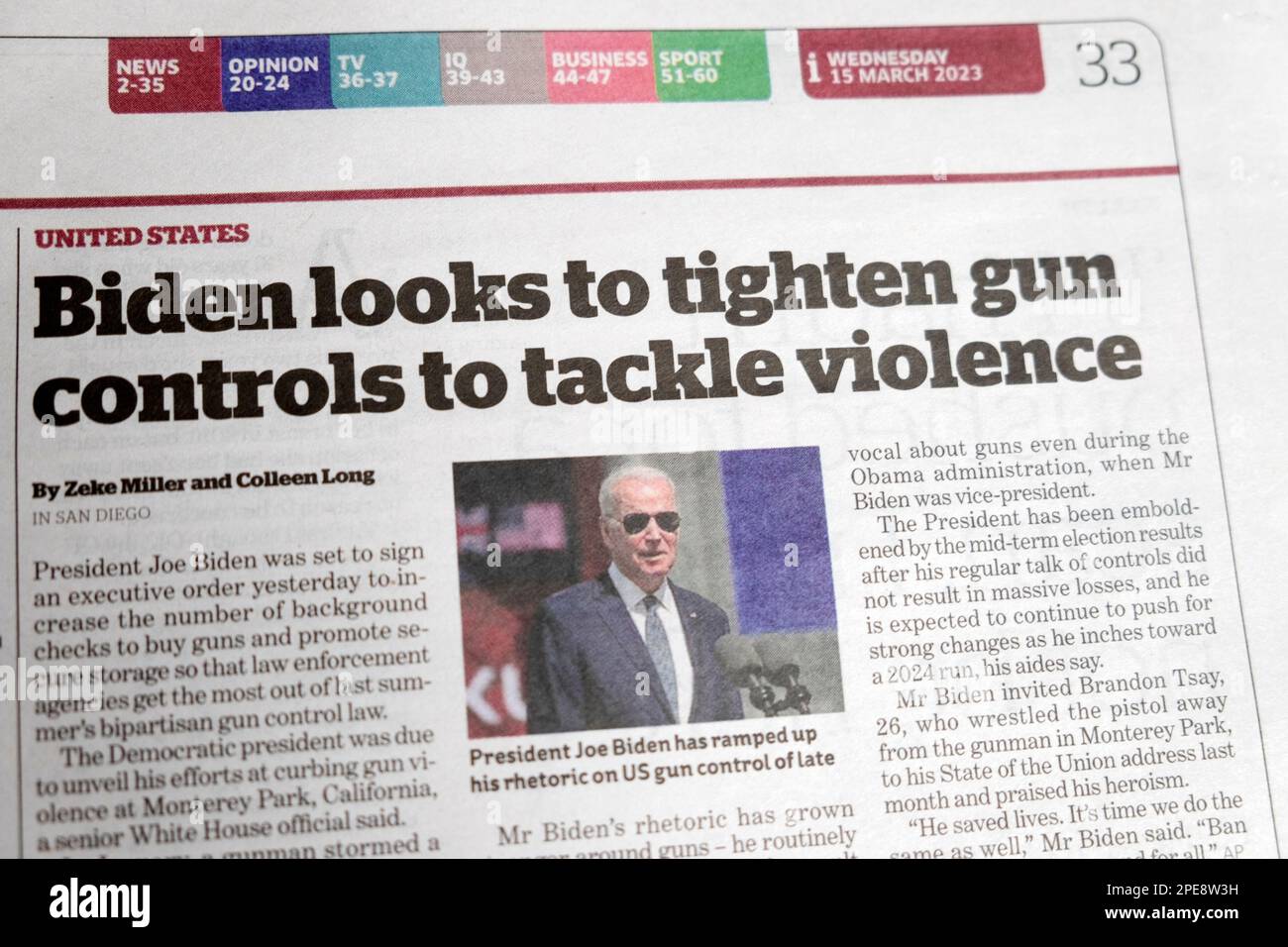 American President Joe 'Biden looks to tighten gun controls to tackle violence' i newspaper headline US guns control article 15 March 2023 London UK Stock Photo