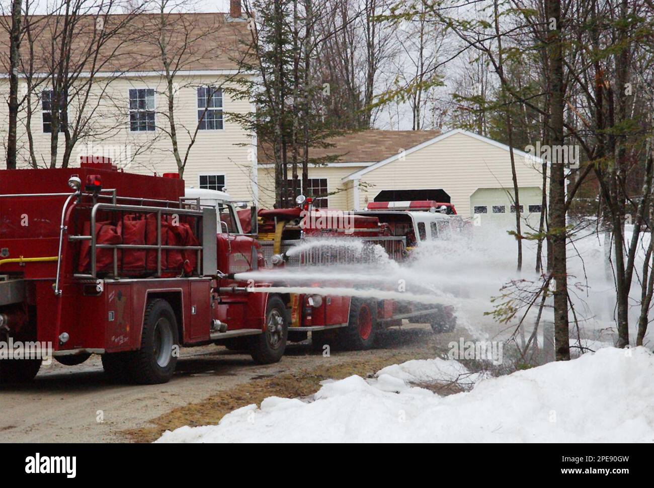 Firefighters from three volunteer departments use suppressant foam to  extinguish a fire in a salt water storage tank at a natural gas well near  Nacogdoches, Texas, on Tuesday, Dec. 4, 2012. Katie