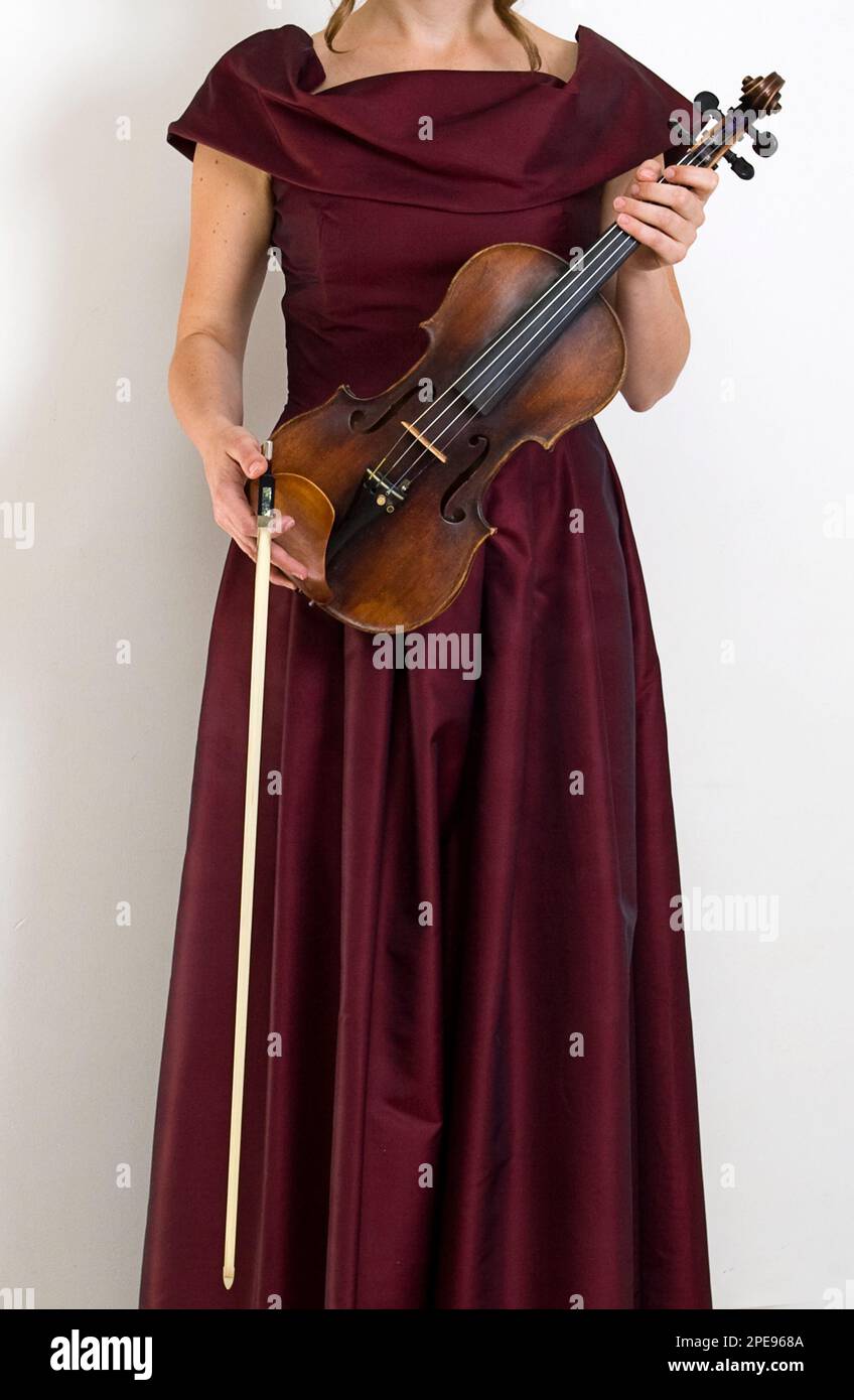 violin under his arm Stock Photo Alamy