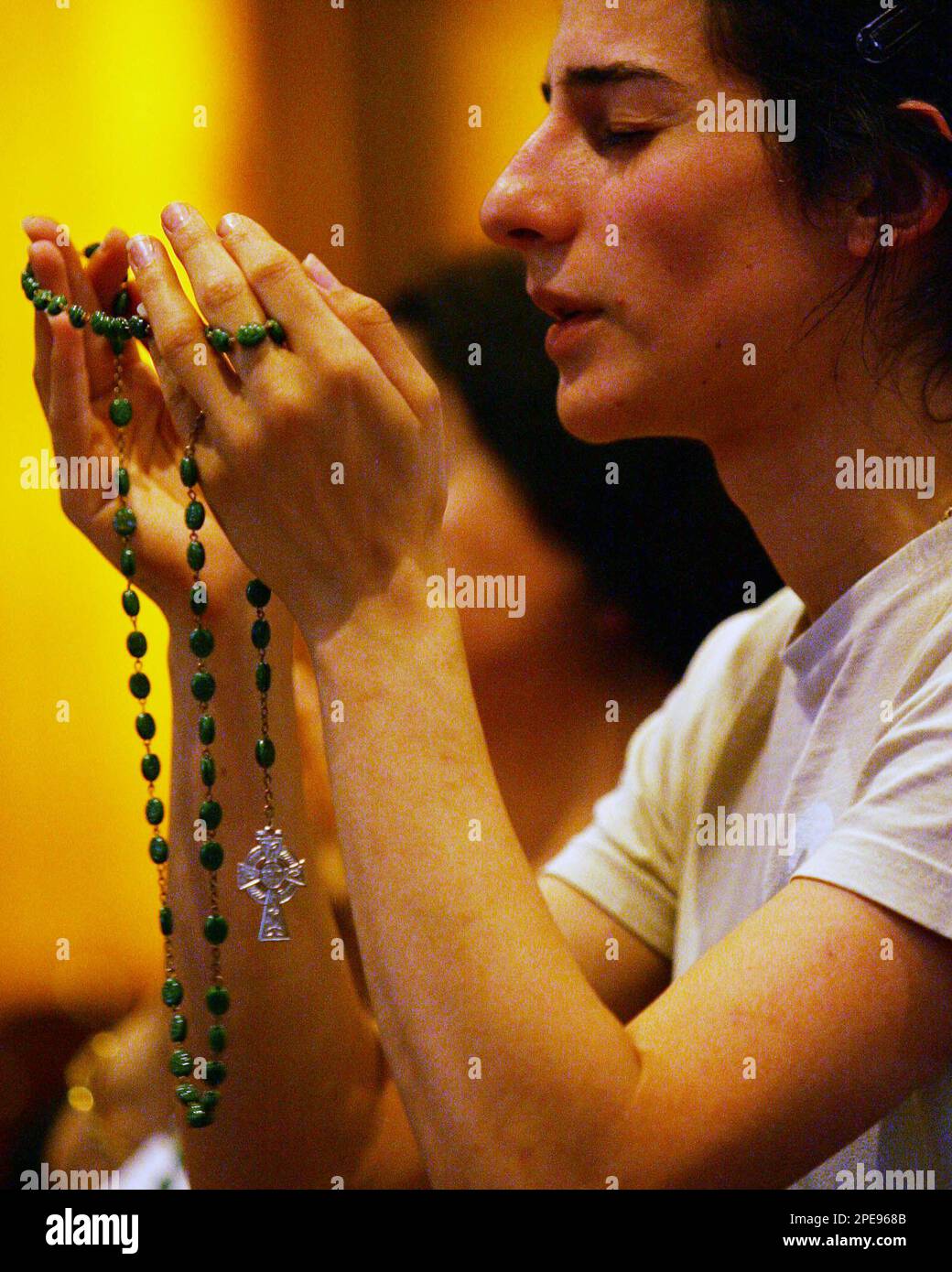 A congregant prays for pope john paul ii at st mary s cathedral in