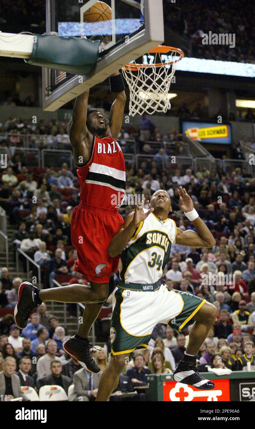 Portland Trail Blazers forward Darius Miles attempts a dunk over Seattle  SuperSonics guard Ray Allen during the first quarter Friday, April 1, 2005,  in Seattle. The ball bounced off the rim on