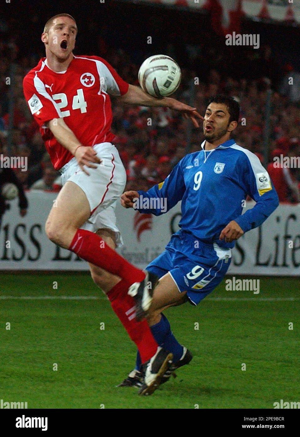 Switzerland's Philippe Senderos, left, and Cyprus' Ioannis Okkas during ...