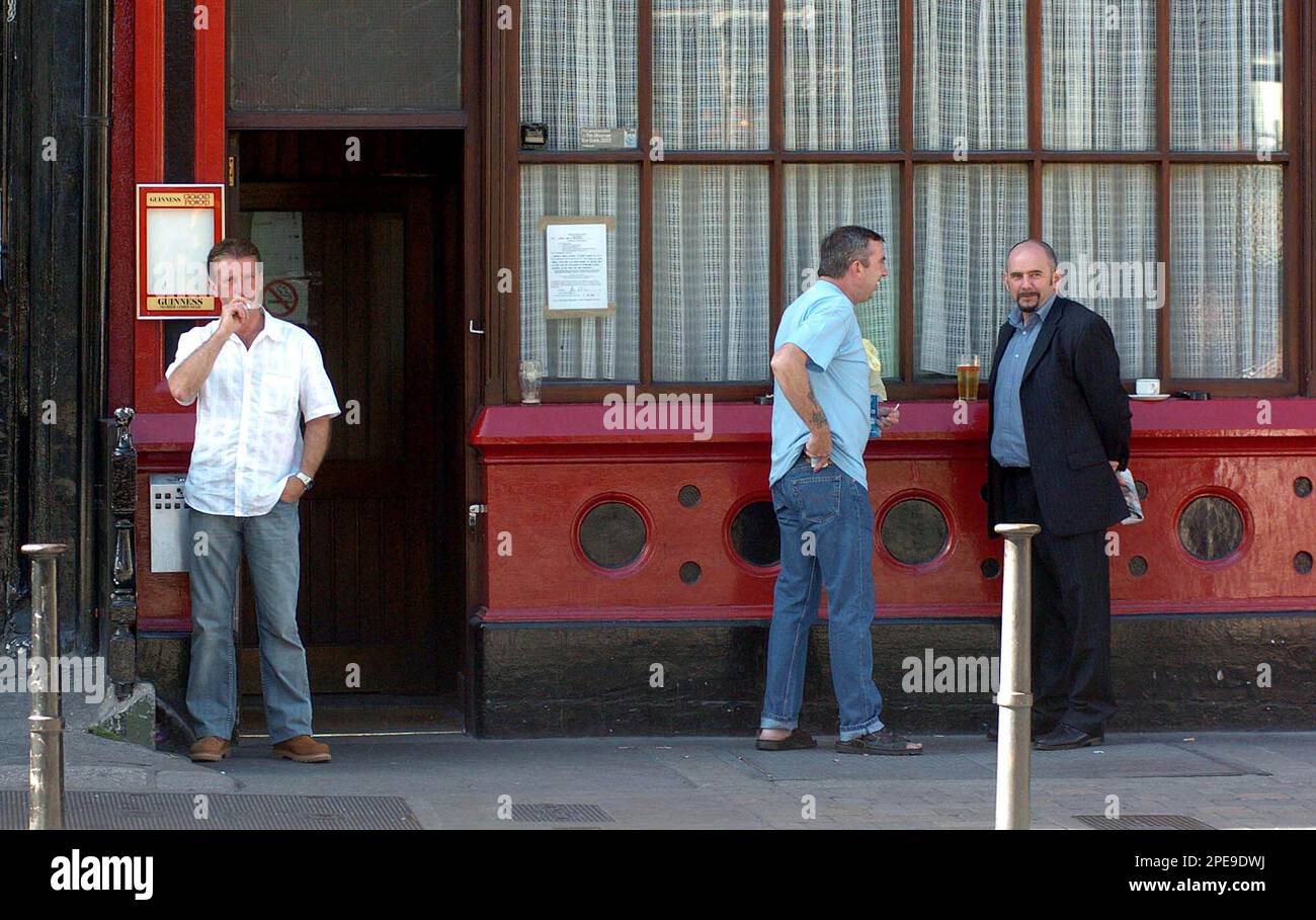 Smokers enjoy a cigarette outside a pub in Dublin, Tuesday March 29, 2005.  Anti-tobacco campaigners toasted a year of Ireland's smoking ban Tuesday, a  measure being widely observed particularly in the country's