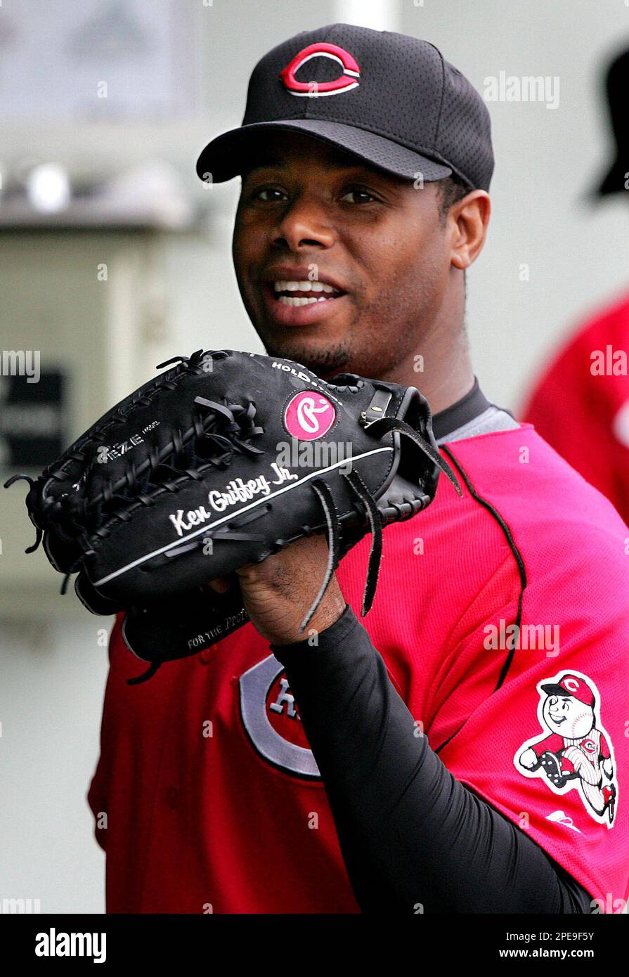 Cincinnati Reds Ken Griffey Jr. spins his glove on his hand prior to a game against the Minnesota Twins in Fort Myers Fla. Monday March 28 2005. Griffey who is recovering from