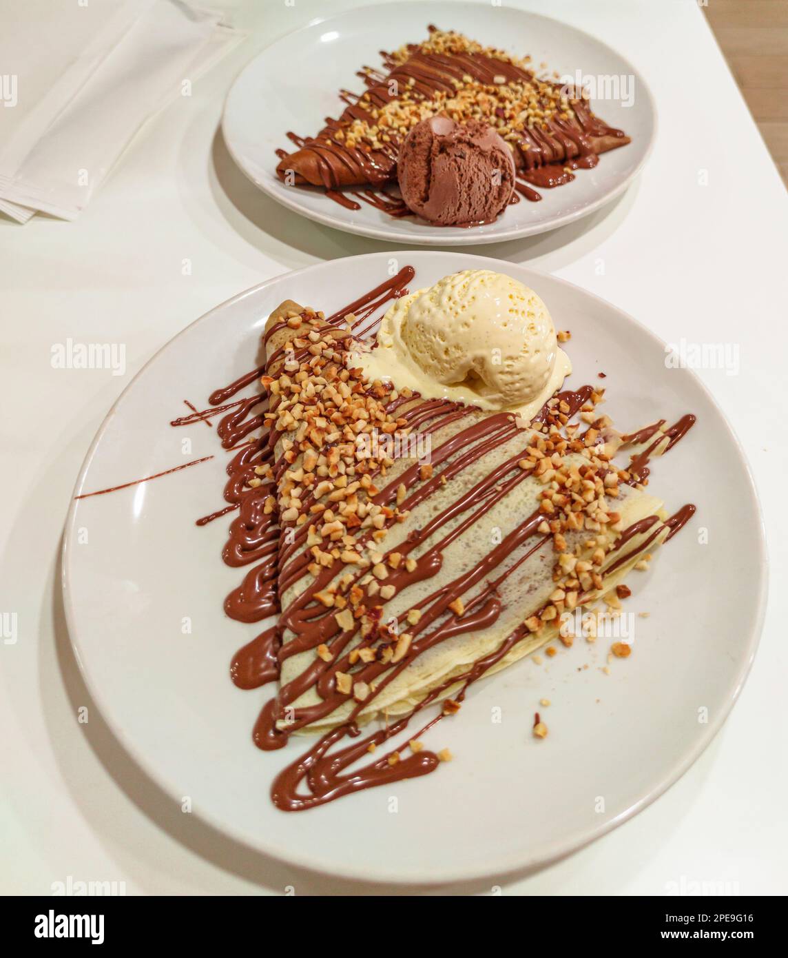 French crepes with chocolate. Closeup of sweet crepes with cream