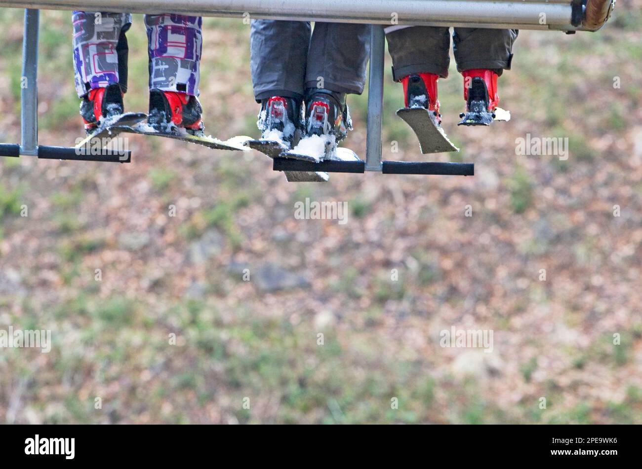 Skiers on a lift Stock Photo - Alamy