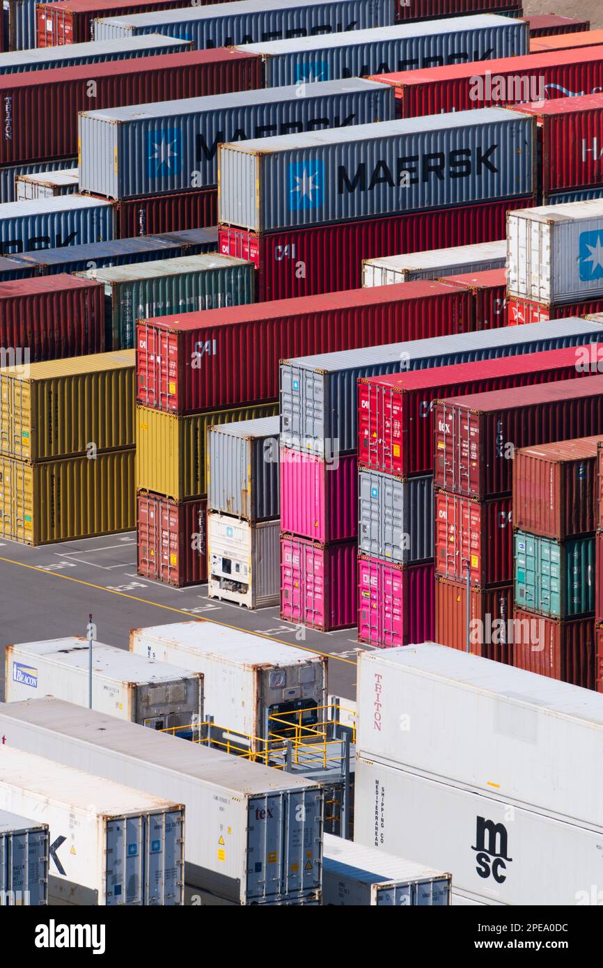 Metal shipping containers in port stacked in lines at Lyttelton Port, Christchurch, New Zealand