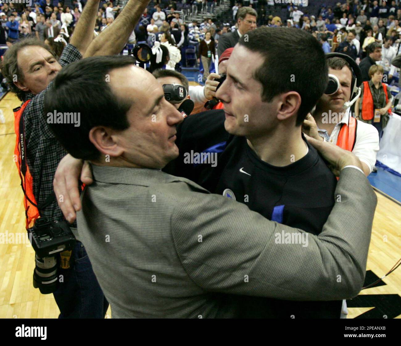 Duke coach Mike Krzyzewski, left, hugs J.J. Redick after defeating