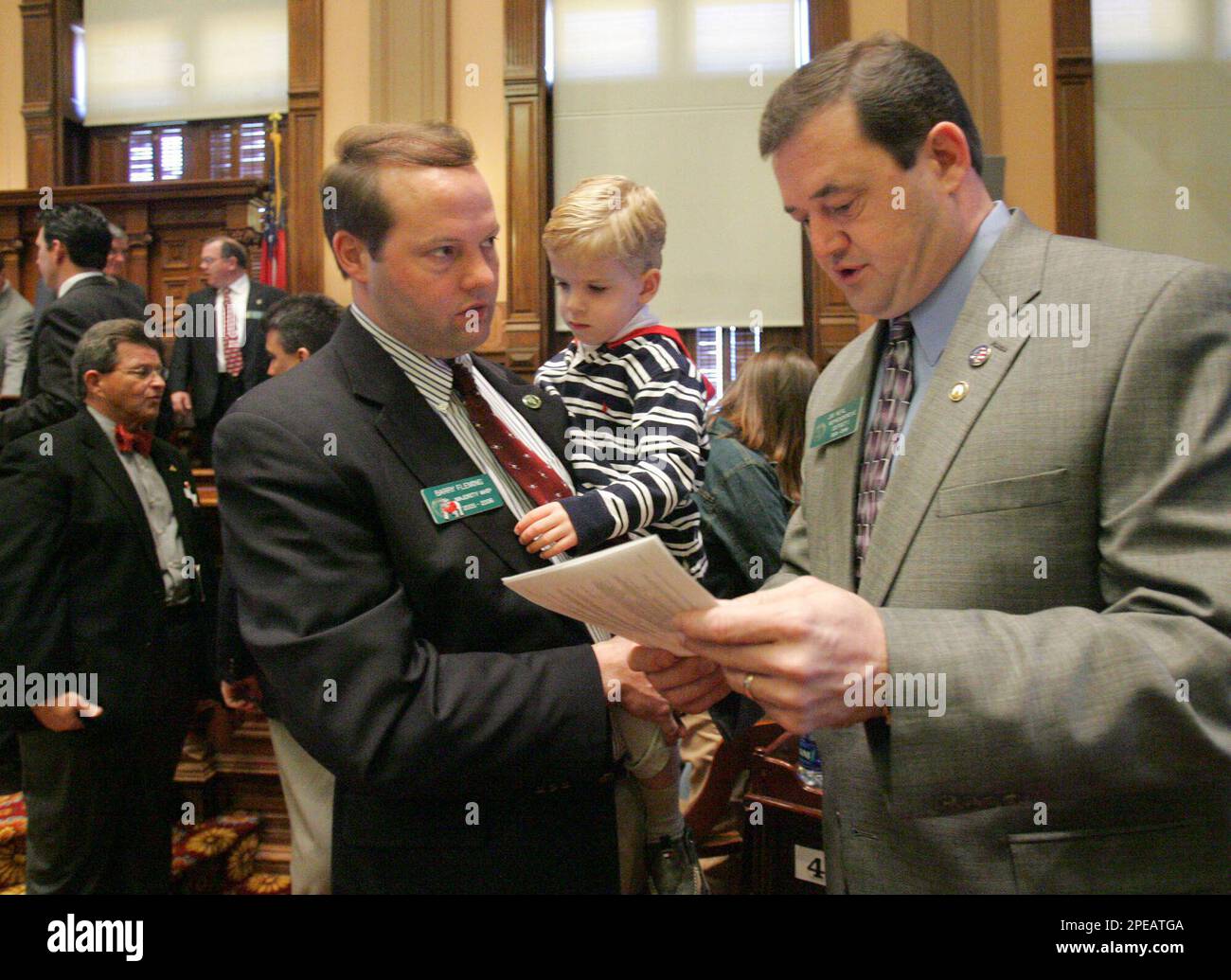 House Majority Whip Barry Fleming, RHarlem, holds his son Zach Fleming
