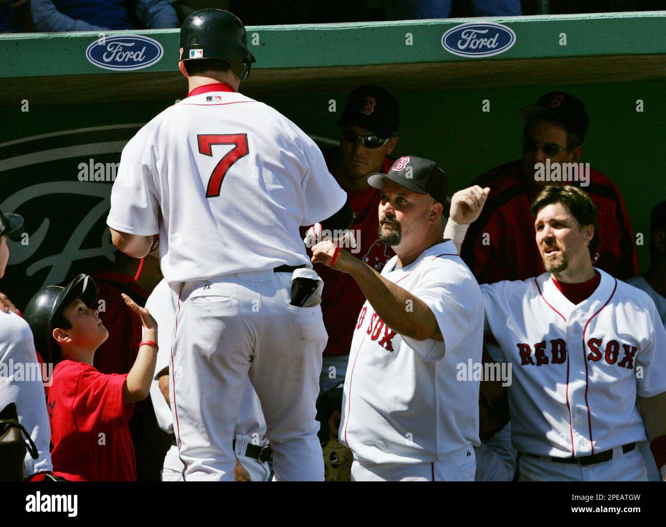 Boston Red Sox's Trot Nixon (7) is congratulated by starting pitcher David  Wells, center, and third baseman Bill Mueller, right, following his solo  home run during the second inning in Fort Myers