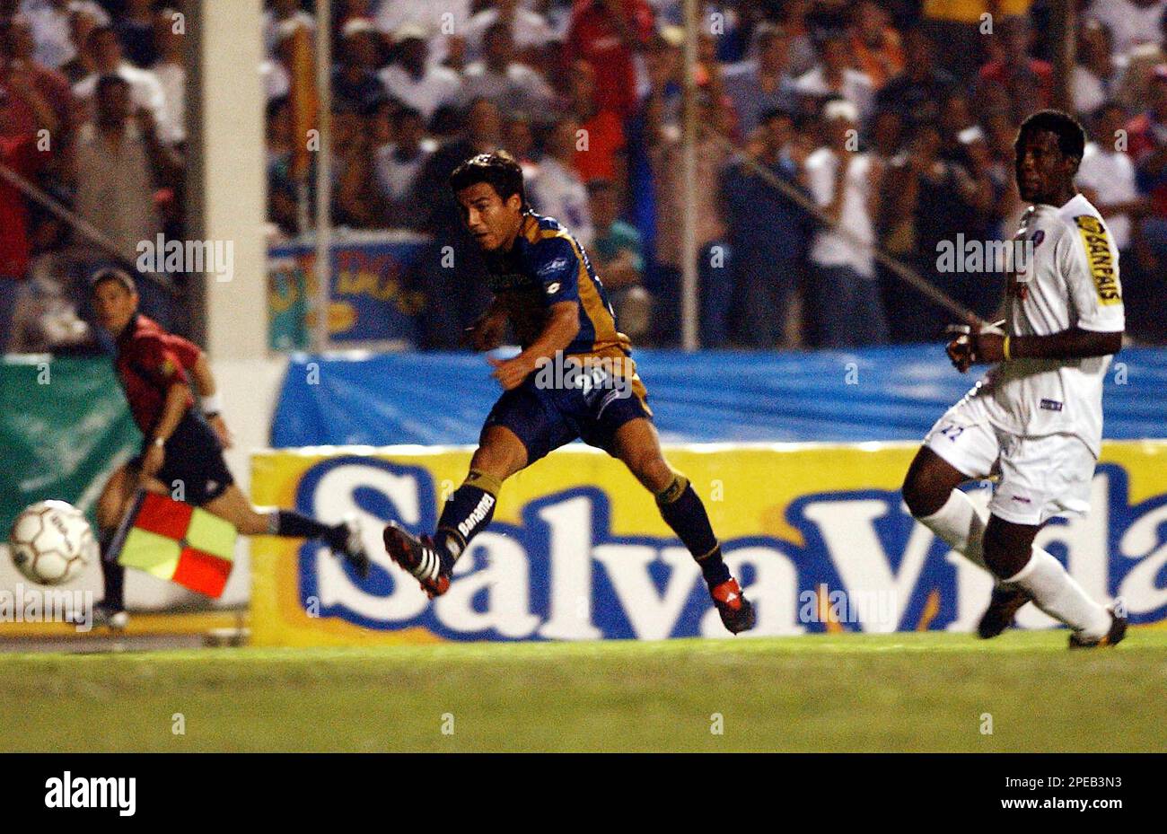 Mexico's Pumas player soccer Ismael Iniguez (20) kicks the ball as  Honduras' Olimpia player Hendry Thomas, right, looks on during a CONCACAF  tournament match at the National Stadium in Tegucigalpa, Honduras,  Wednesday,