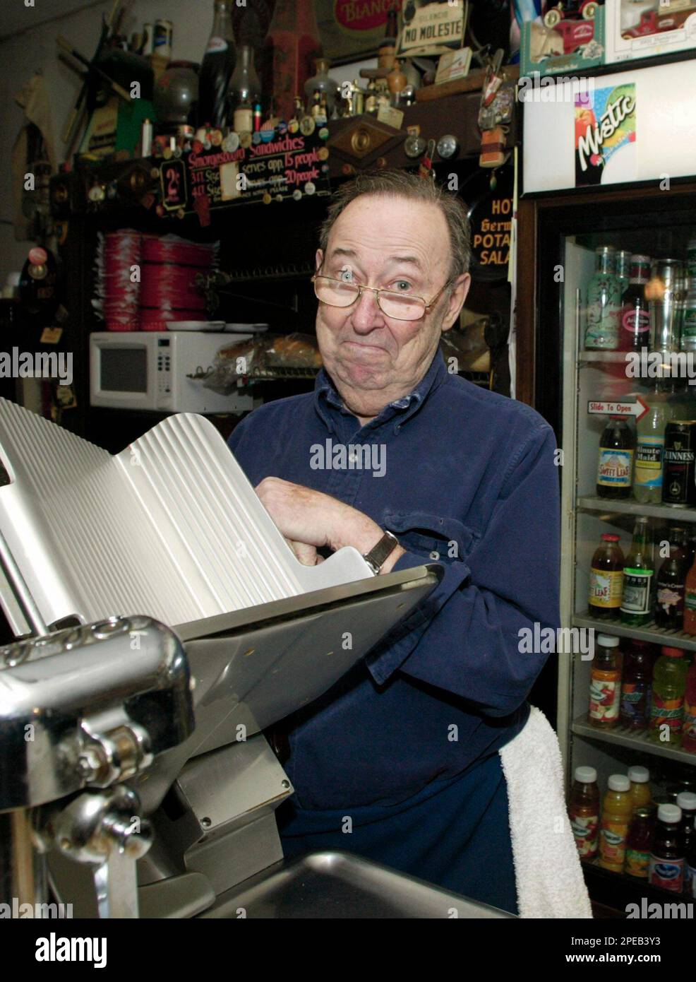 Jack Carl, owner of Two Cents Plain, a New York-style deli in St. Louis,  stands behind the counter at the deli Wednesday, March 9, 2005. Call it the  big basketball event. Call