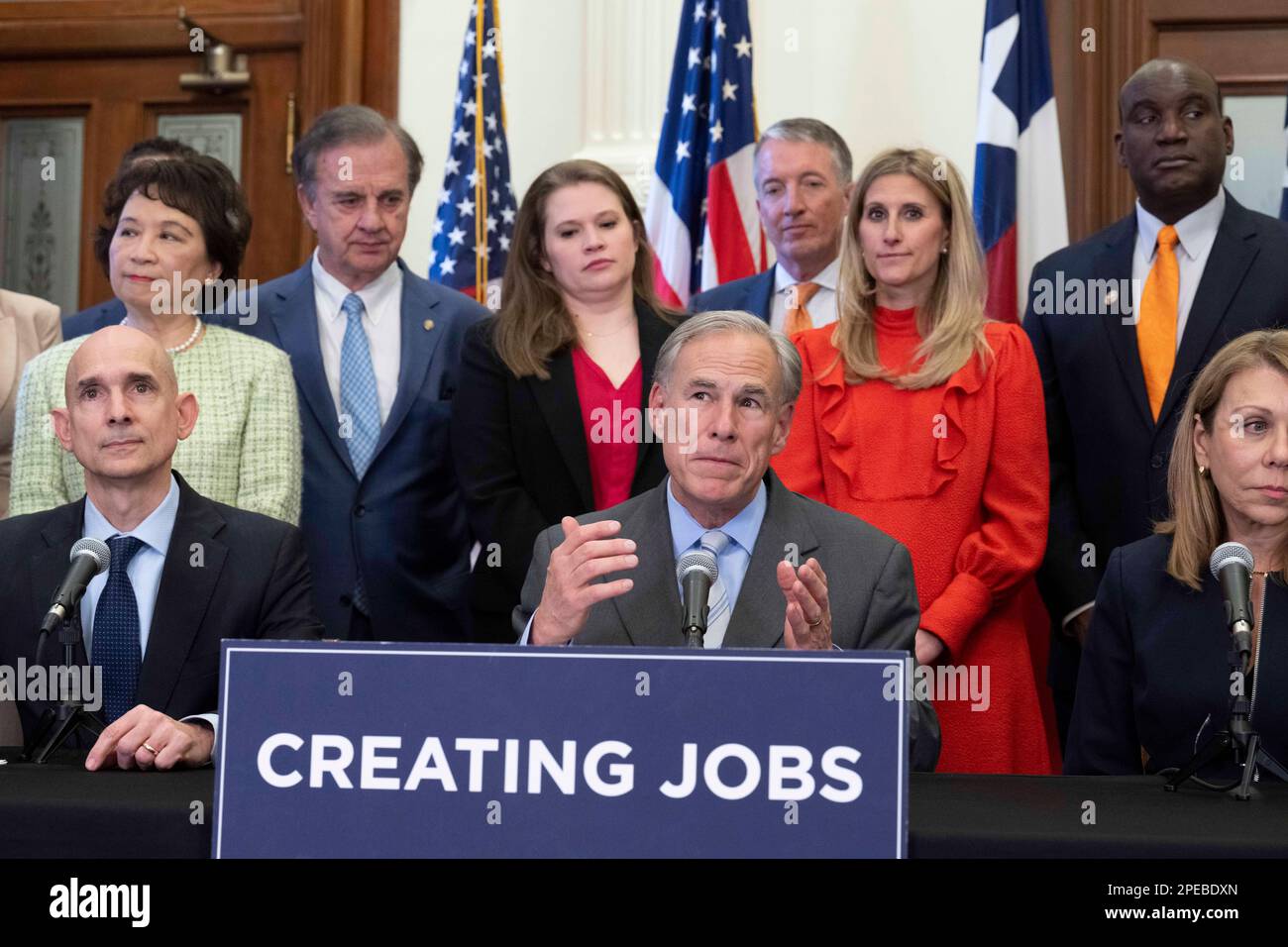Austin Texas, USA. 15th Mar, 2023. Texas Governor GREG ABBOTT, seated center, along with Texas Sen JOAN HUFFMAN, far right, elected officials, educators and business representatives, holds a press conference supporting the Texas CHIPS Act. The Creating Helpful Incentives to Produce Semiconductors (CHIPS) Act, if passed, would focus on Texas research and development efforts in winning semiconductor chip projects. Credit: Bob Daemmrich/Alamy Live News Stock Photo