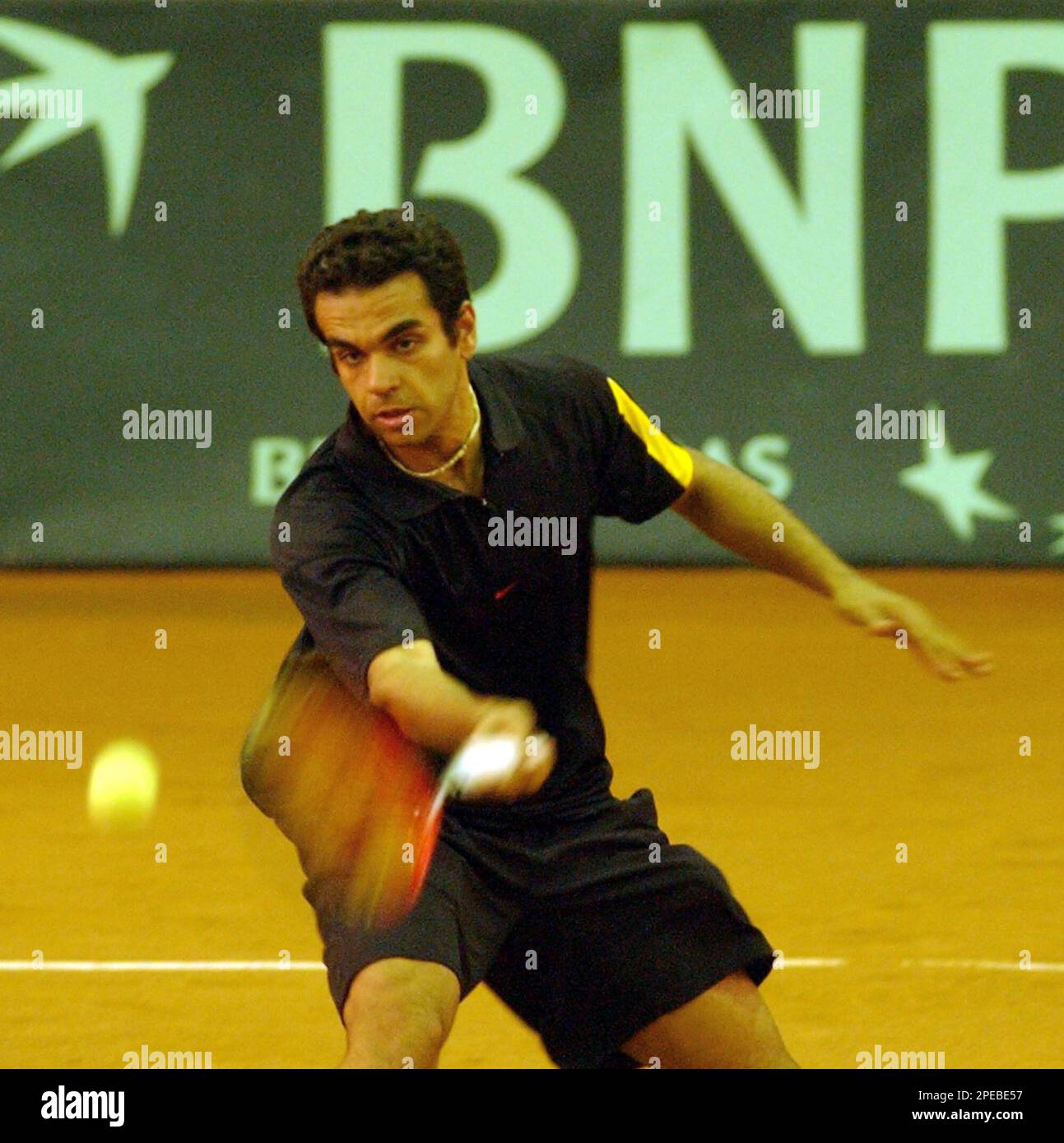 Shahab Hassani, from Iran, returns the ball to Ahmed Rabiee, from Kuwait, during their Davis Cup men's singles match at the Shiroudi sport complex in Tehran, Iran, Sunday, March 6, 2005. (AP Photo/Vahid Salemi) Stock Photo