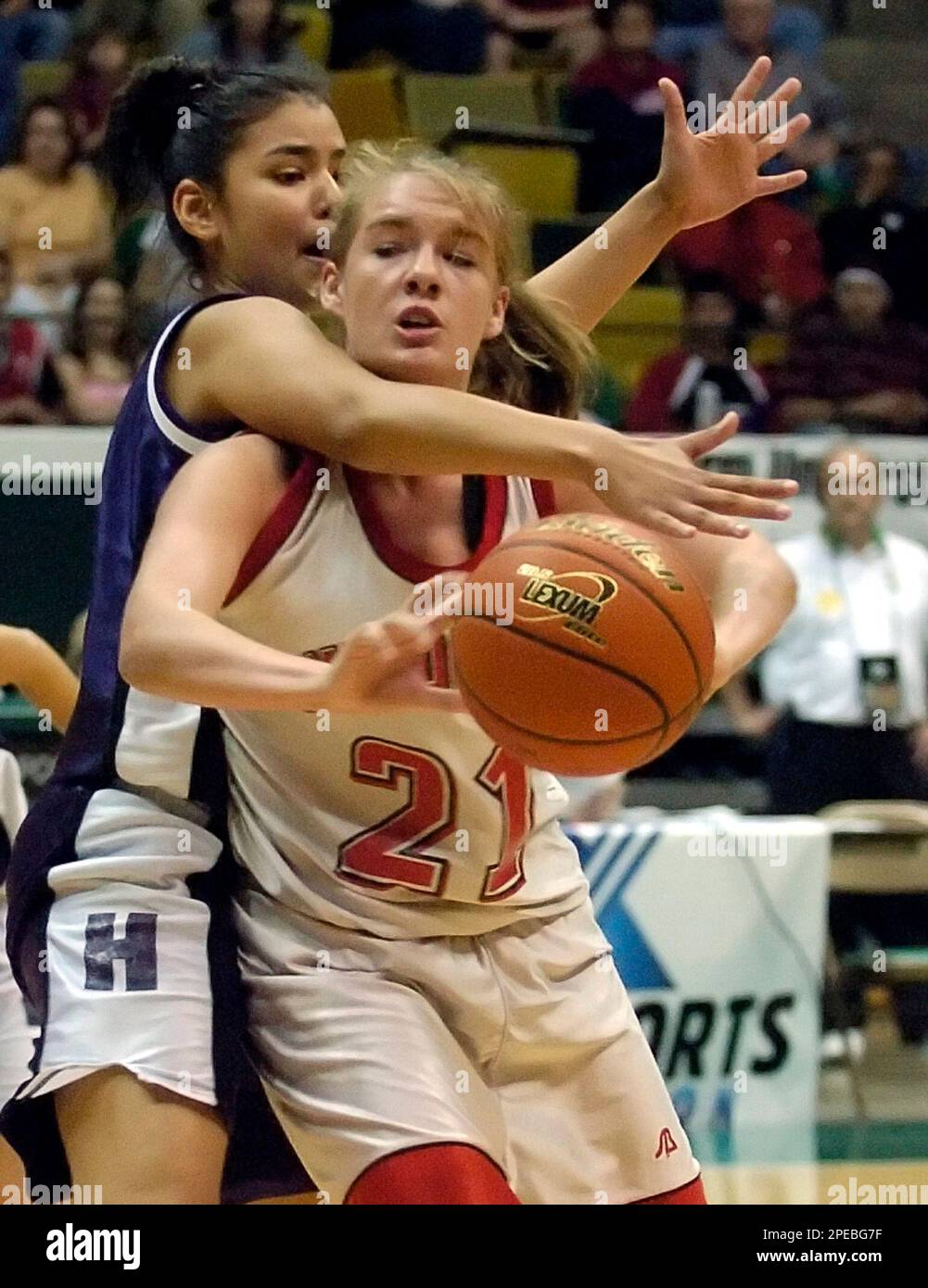Holden's Ana Munoz (34) reaches over the shoulder of Glenmora's