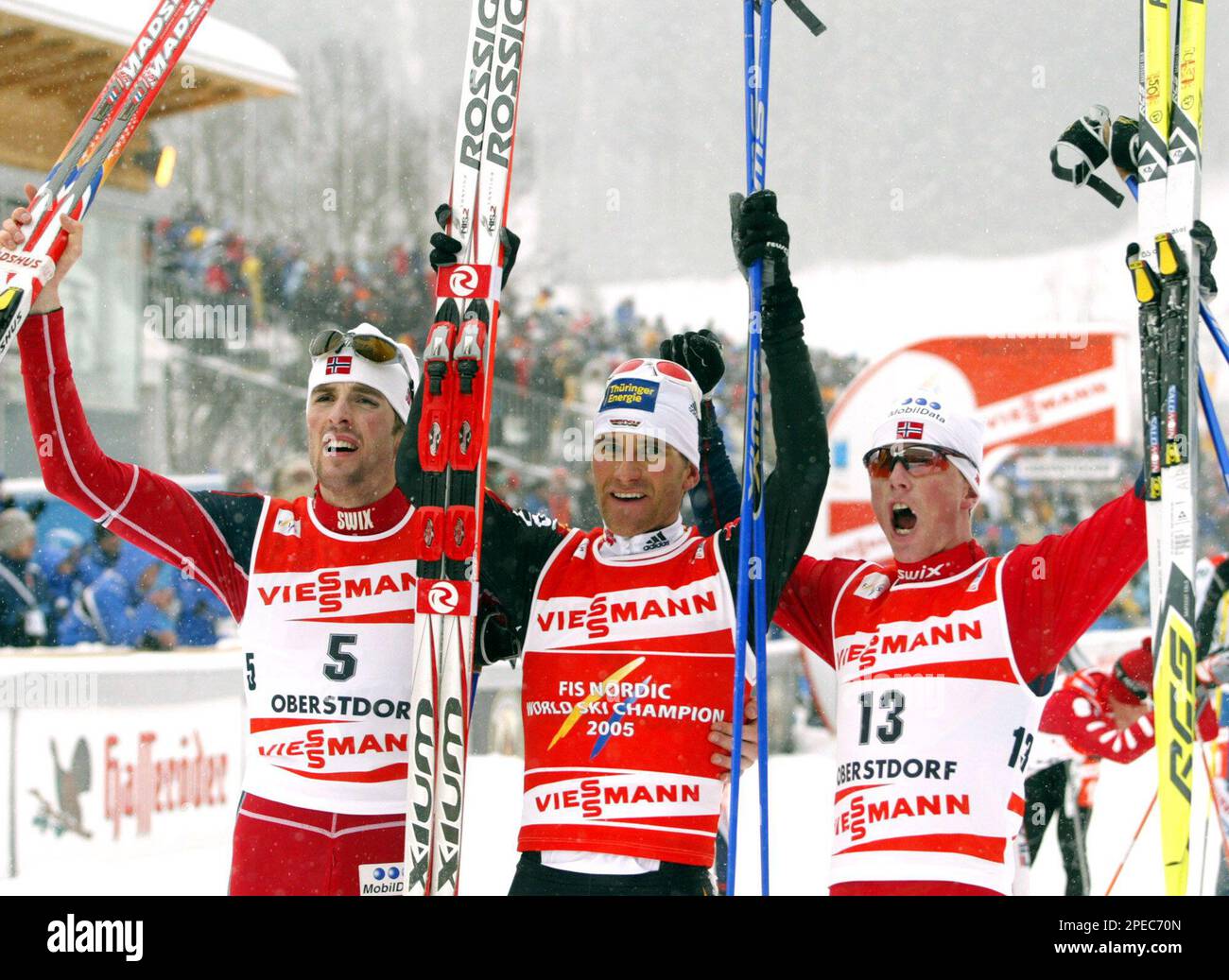 Winner Ronny Ackermann from Germany, center, 2nd placed Magnus Moan, left,  and 3rd placed Kristian Hammer, right, both from Norway, celebrate after  the Nordic Combined sprint event at the Nordic Ski World
