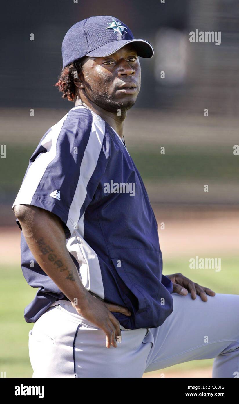 Seattle Mariners' Pokey Reese rests after a spring training
