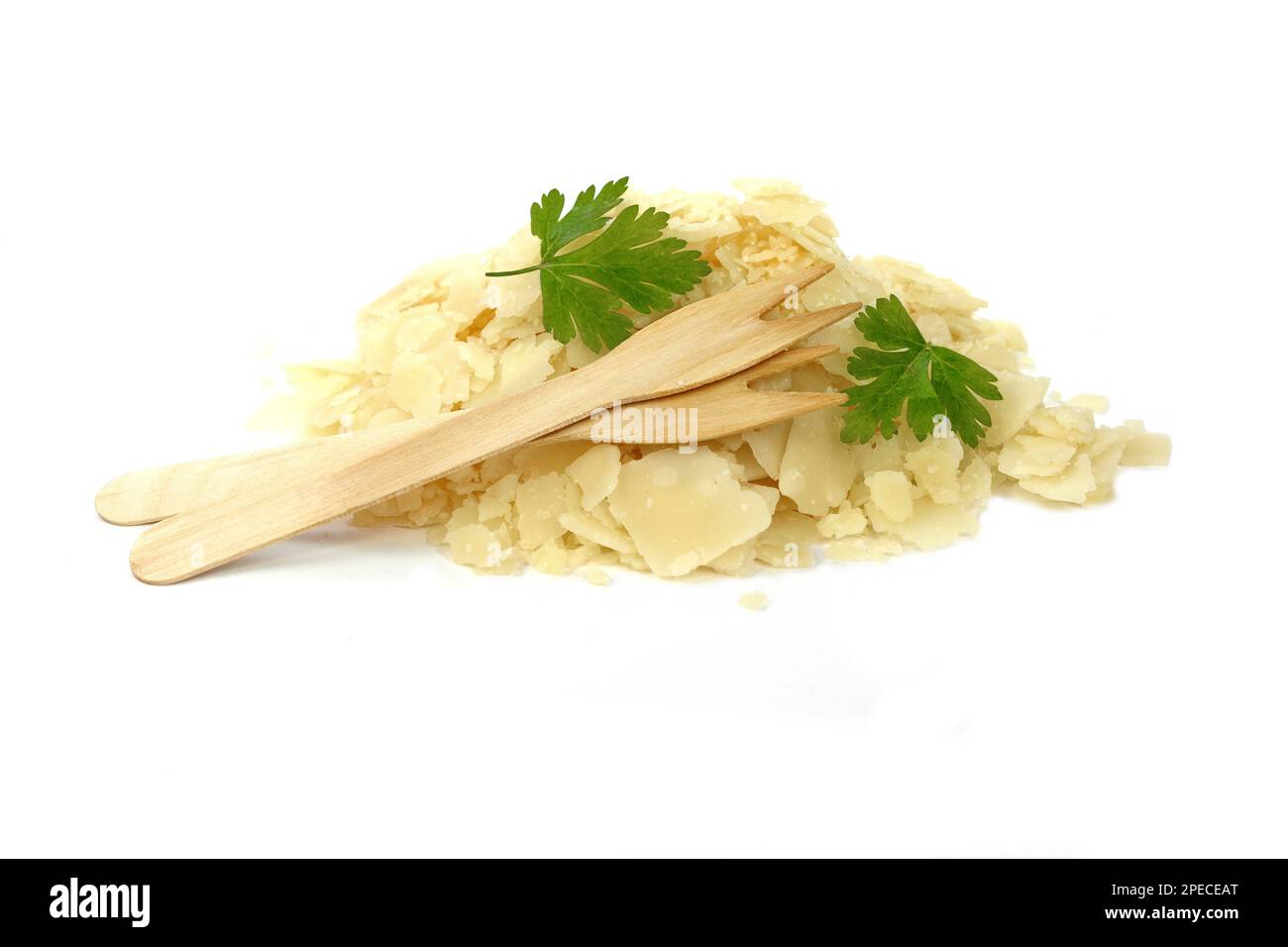 Parmesan cheese flakes isolated on white background. Pile of parmesan
