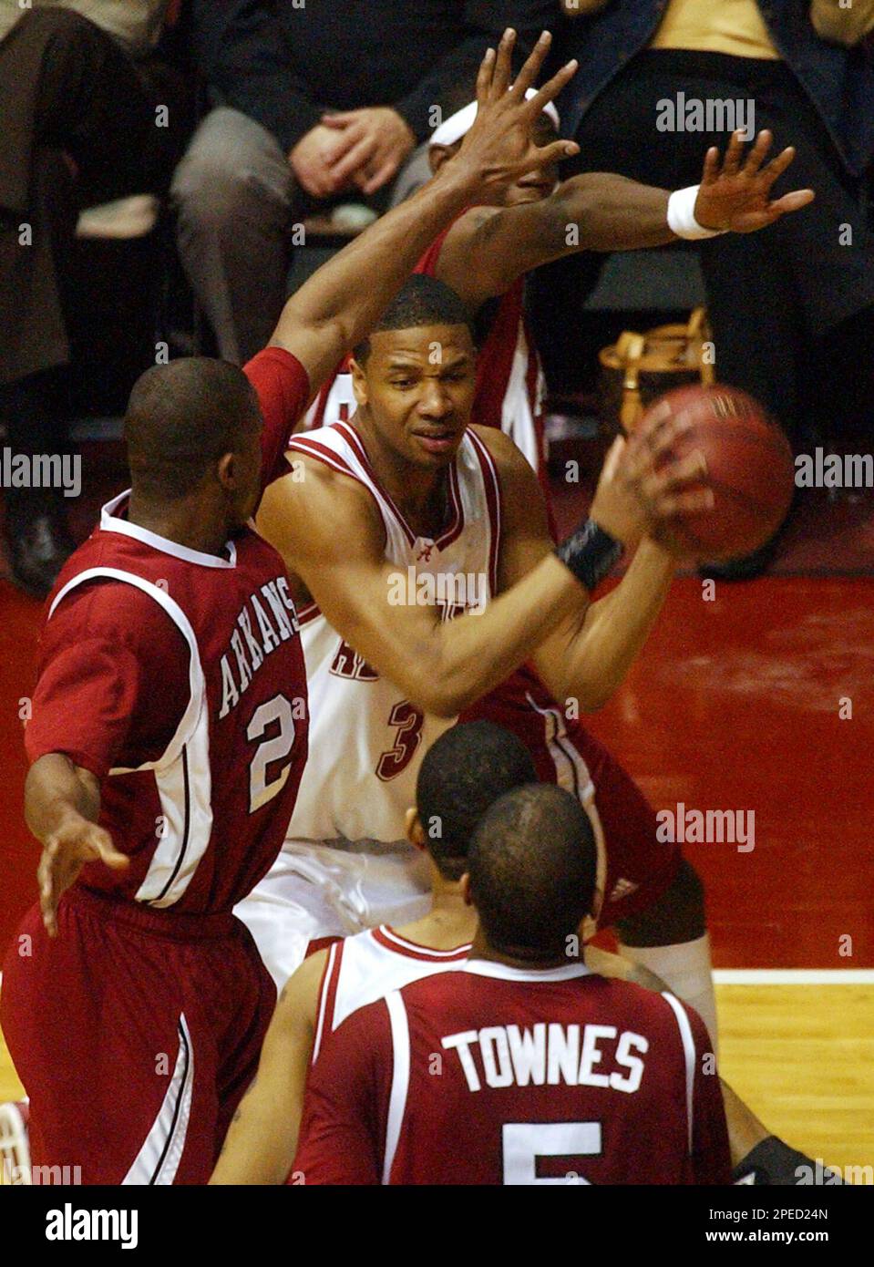 Alabama forward Kennedy Winston (3) looks to pass as Arkansas guard Jonathon Modica, left, and