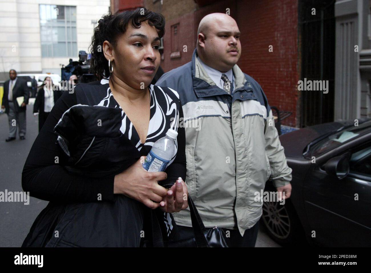 Luz Ida Cuevas, left, mother of victim Delimar Vera, leaves court in