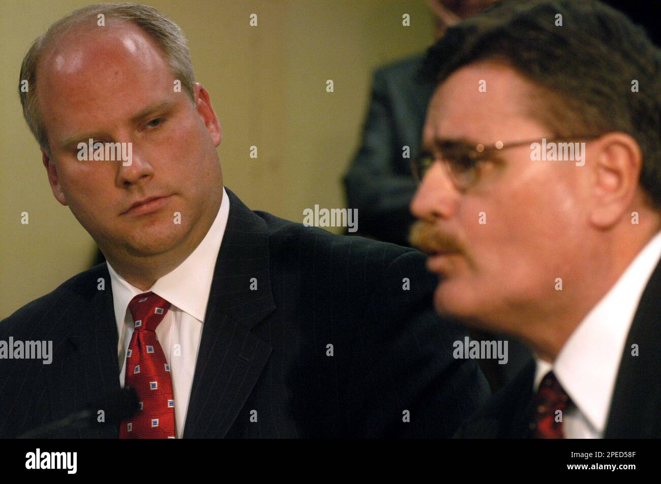 Rep. Dustin McDaniel, D-Jonesboro, left, listens to Dr. Mark Riley ...