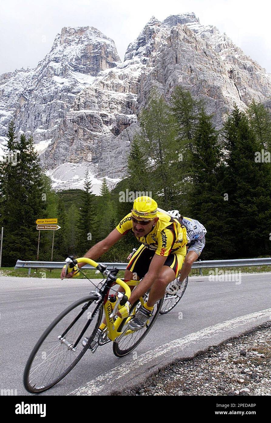 ** FILE **Italian cyclist Marco Pantani pedals through the Dolomite mountains during the 16th stage of the Tour of Italy cycling race, from Conegliano Veneto to Corvara in Badia, near Bolzano, Italy, in this file photo taken on May 29, 2002. A former Tour de France and Giro d'Italia winner, Marco Pantani was found dead in a residence in Rimini, northern Italy, one year ago, on Feb. 14, 2004. (AP Photo/Alessandro Trovati) Stock Photo