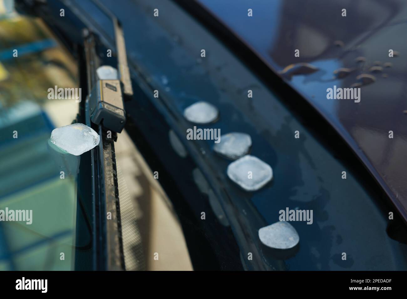 Closeup view of car window with hail grains after thunderstorm Stock