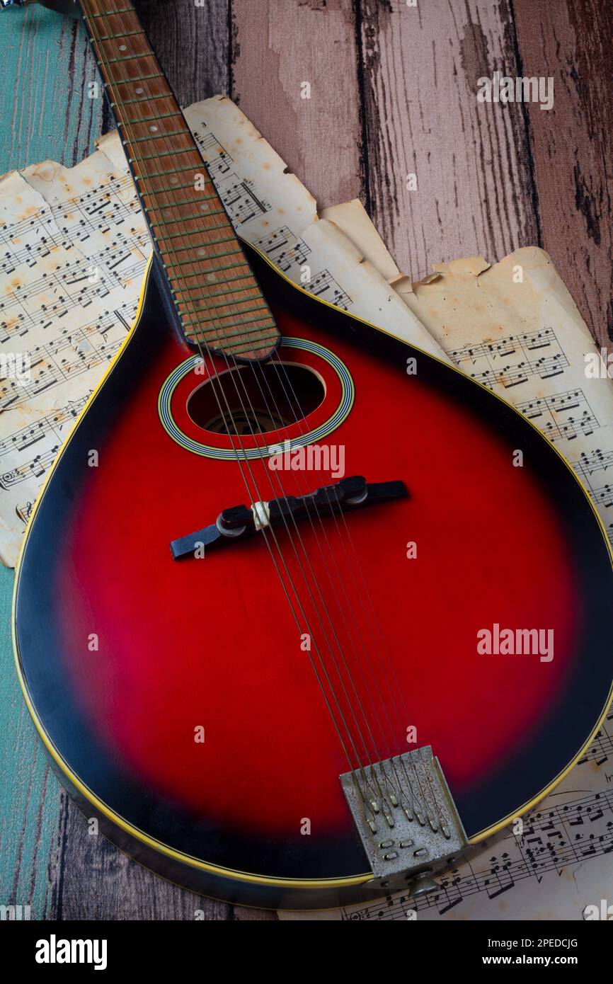 Red And Black Mandolin and sheet music still life Stock Photo Alamy
