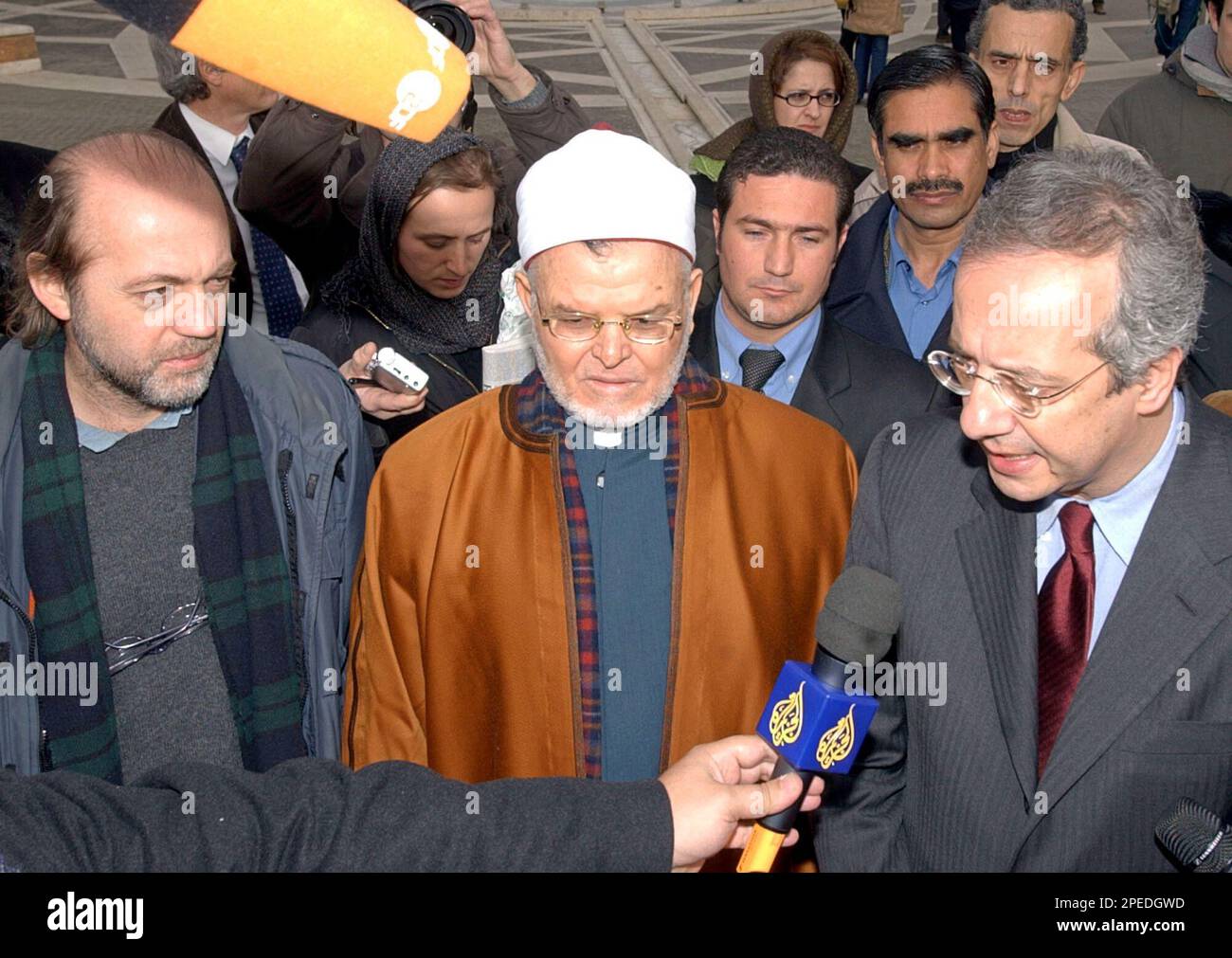 From left, "Il Manifesto" daily editor-in-chief Gabriele Polo and Rome  Mosque Imam Mohamed Shewita, listen on to Rome Mayor Walter Veltroni make  an appeal during an interview with Al Jazeera, for the