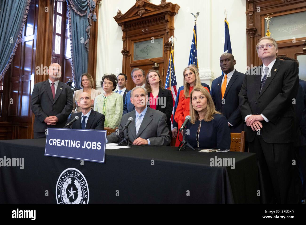 Austin, TX, USA. 15th Mar, 2023. Texas Governor GREG ABBOTT, r, along with Texas Sen JOAN HUFFMAN, far right, elected officials, educators and business representatives, holds a press conference supporting the Texas CHIPS Act. The Creating Helpful Incentives to Produce Semiconductors (CHIPS) Act, if passed, would focus on Texas research and development efforts in winning semiconductor chip projects. Credit: ZUMA Press, Inc./Alamy Live News Stock Photo