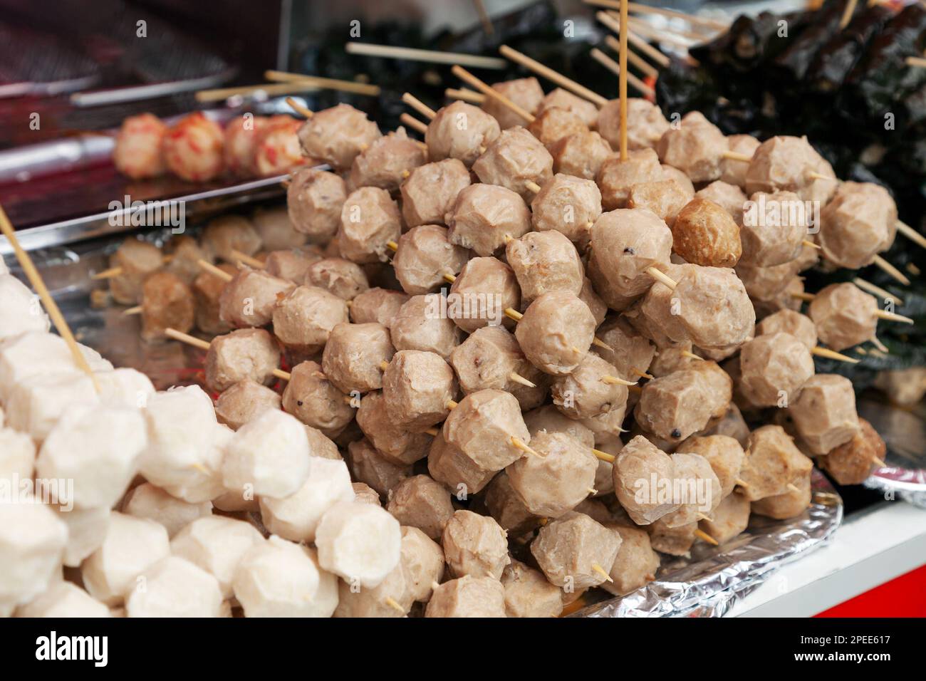 Pile of fish balls on skewers at a Vietnamese market. Traditional