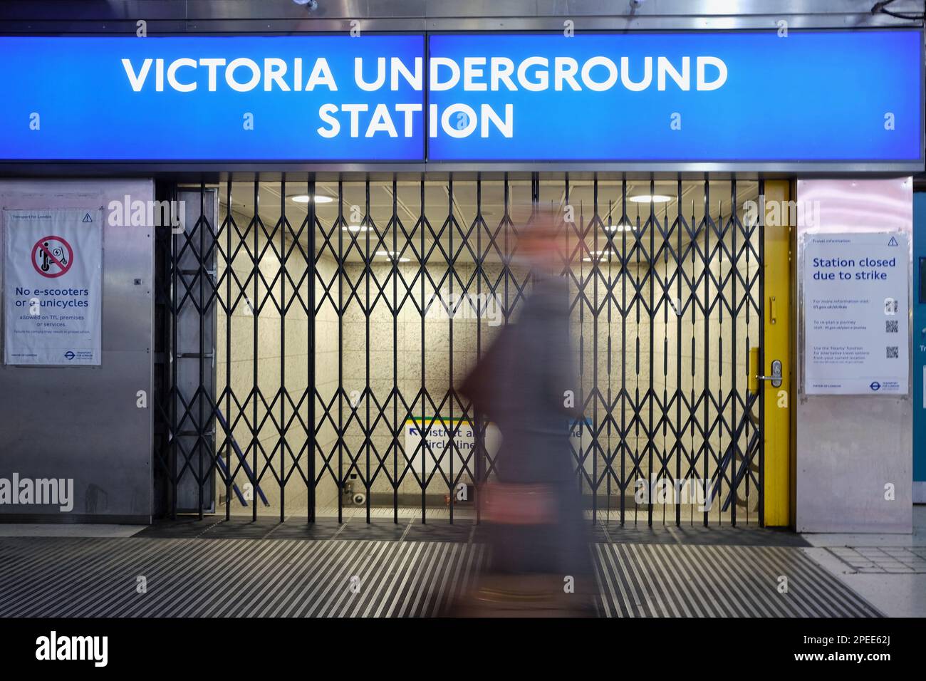 London, UK. 15th March, 2023. A person passes the closed gates outside