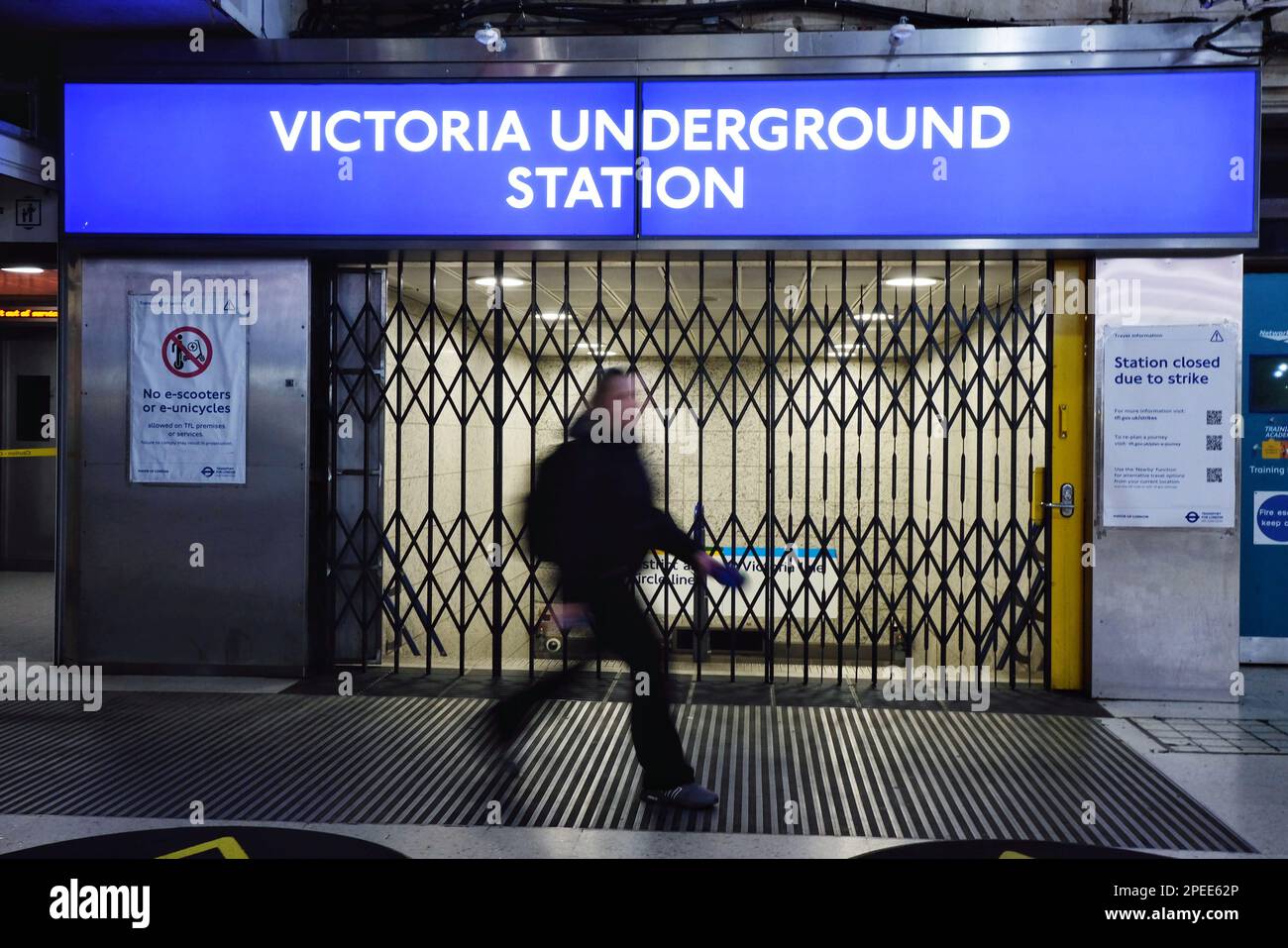 Victoria Overground London, UK. 15th March, 2023. A person passes the closed gates outside ...