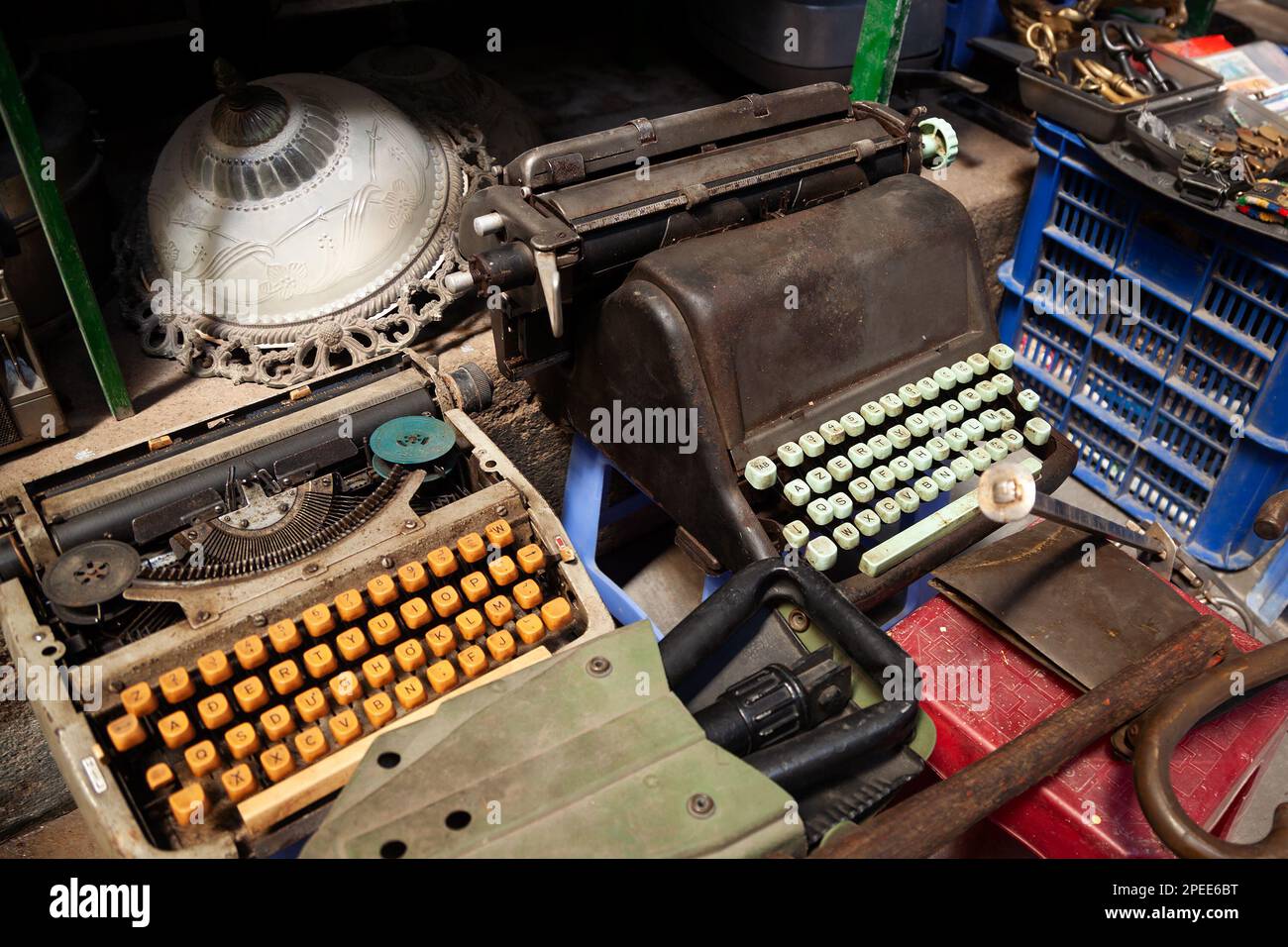Antique typewriters and other collectible memorabilia at a flea market. Old junk at a garage sale Stock Photo