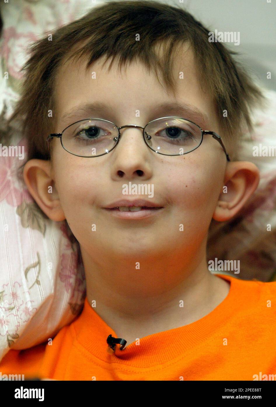 David Dingman-Grover, a 9-year-old boy of Sterling, Va., who was diagnosed  in May 2003 with embryonal rhabdomyosarcoma, praises his mother Tuesday,  Feb.1, 2005, during a news conference at the Beverly Hilton Hotel,