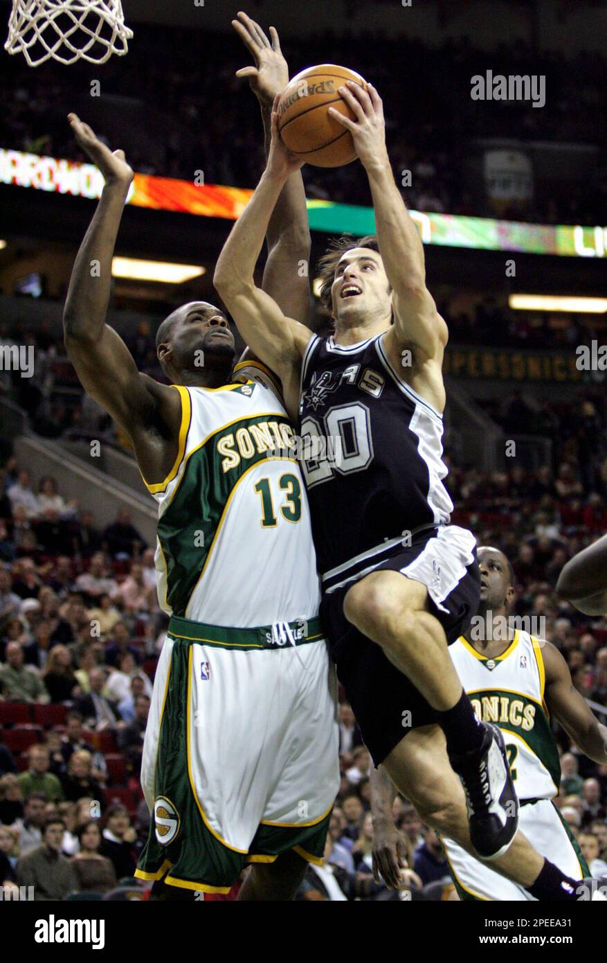 Seattle SuperSonics' Jerome James defends as San Antonio Spurs' Nazr  Mohammed (2) looks to pass in the second quarter Sunday, May 15, 2005 at  KeyArena in Seattle in game 4 of the