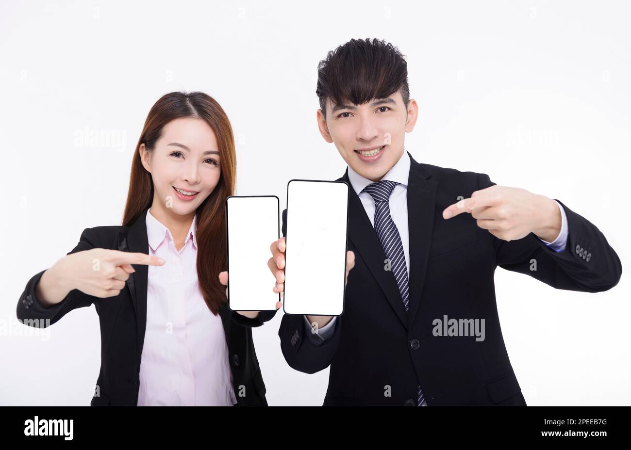 Business man and woman pointing at smartphone with white screen Stock Photo