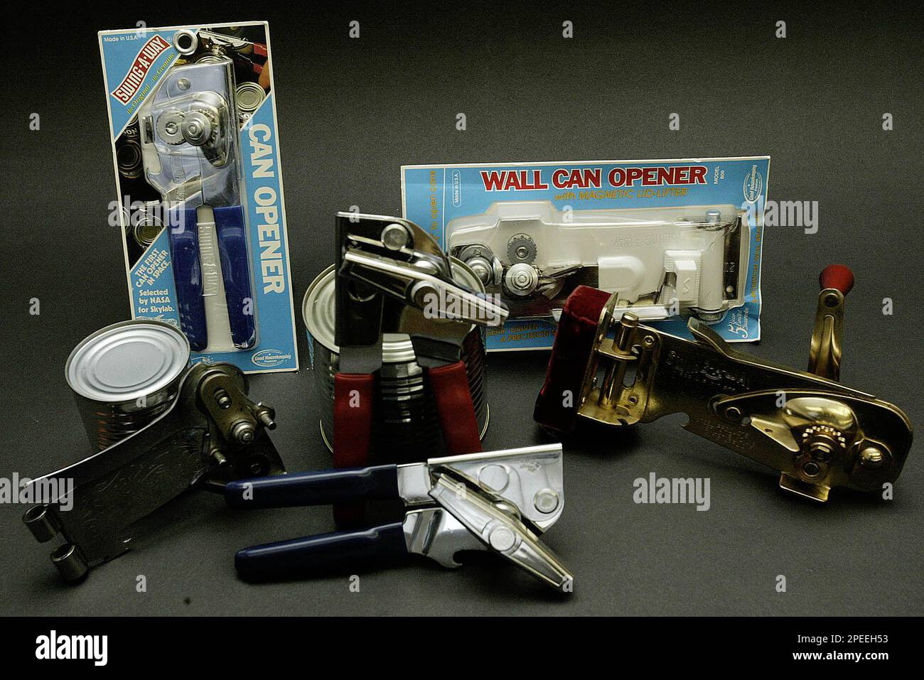 https://c8.alamy.com/comp/2PEEH53/advance-for-weekend-jan-29-30-a-collection-of-can-openers-are-shown-thursday-jan-27-2005-made-by-swing-a-way-manufacturing-company-in-st-louis-fifty-one-years-after-idus-rhodes-launched-a-handy-kitchen-gadget-from-his-st-louis-factory-the-swing-a-way-can-opener-is-still-cranking-out-the-customer-compliments-and-remains-the-industry-leader-the-200-million-sold-since-then-and-roughly-3-million-each-year-occupy-a-spot-in-many-us-kitchens-silverware-drawers-the-openerhas-carried-the-good-housekeeping-seal-for-decades-and-was-the-first-in-space-selected-by-nasa-for-skyla-2PEEH53.jpg