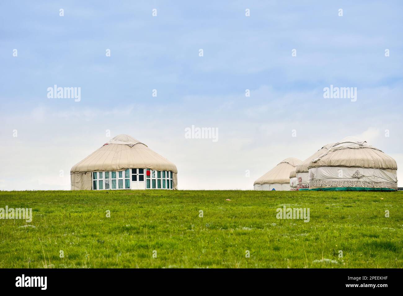 A Kazakh felt house, also known as a yurt, is a traditional nomadic dwelling made from felt and other natural materials. Stock Photo