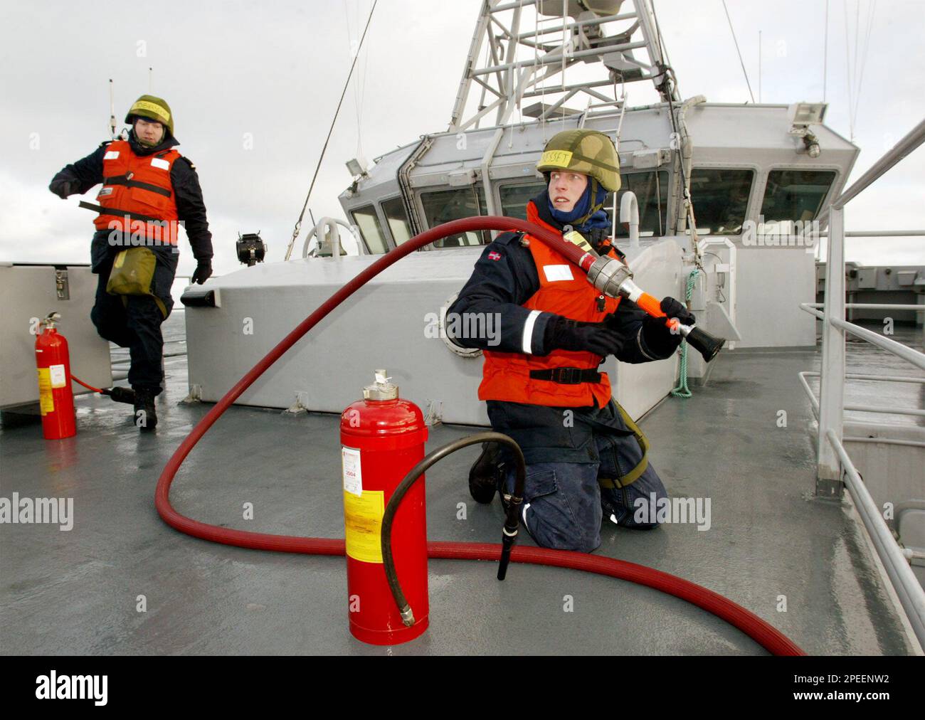 Crew members of the Norwegian mine sweeper "Alta" prepare on deck as