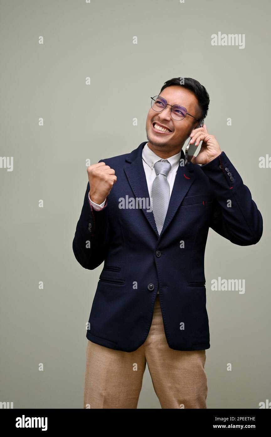 Curated visual reference: Someone Yes Reference: Portrait Of Cheerful And Successful Millennial Asian Businessman In