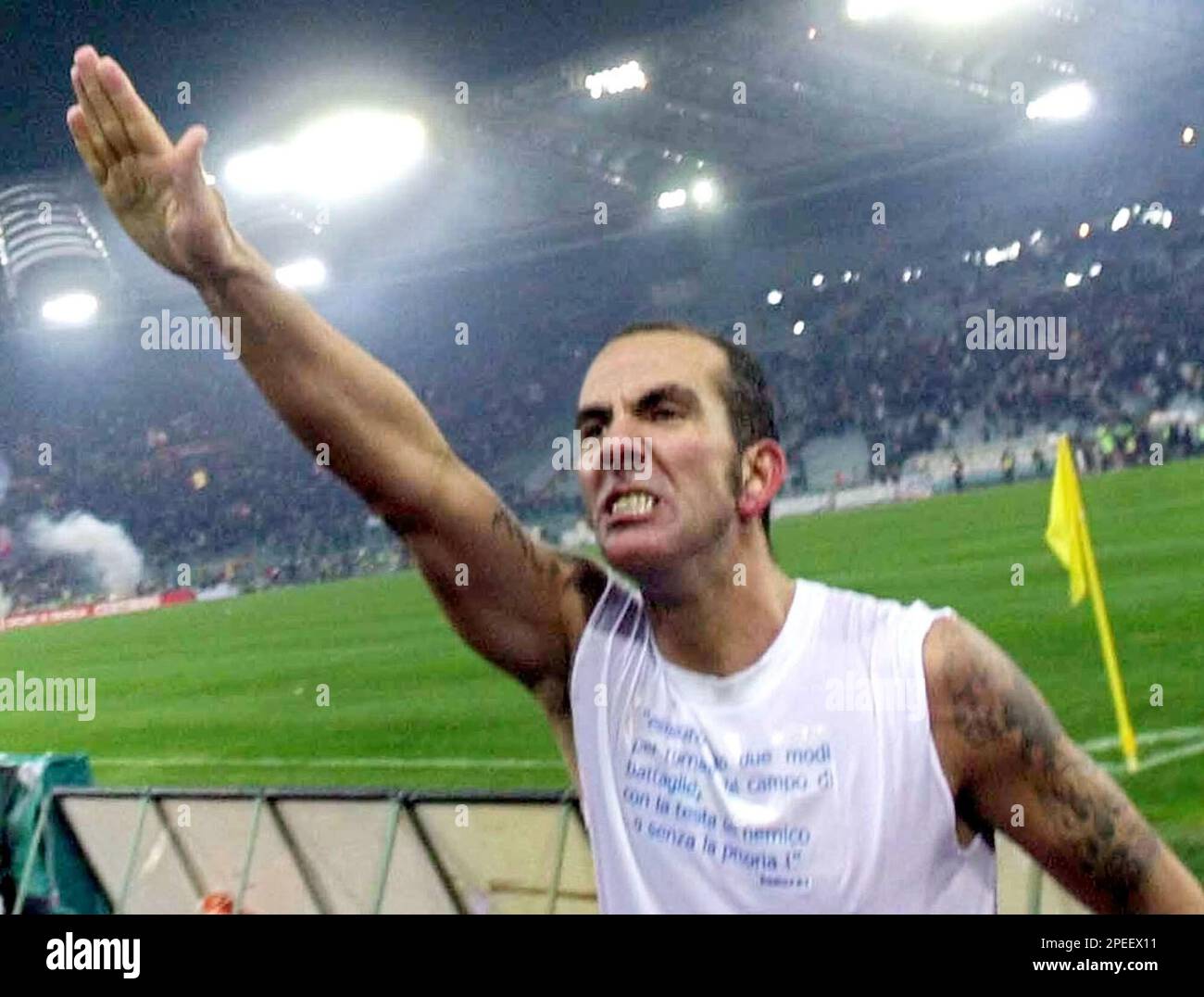 ** FILE ** Lazio's Paolo Di Canio gives a straight-arm salute to supporters, at the end of the Serie A top league soccer match between Lazio and AS Roma at Rome's Olympic stadium, in this Thursday, Jan. 6, 2005 file photo. Italy's soccer federation denounced, Monday, Jan. 24, 2005, Di Canio for "infringing loyalty and correctness principles of sports. (AP Photo/Giuseppe Calzuola) Stock Photo