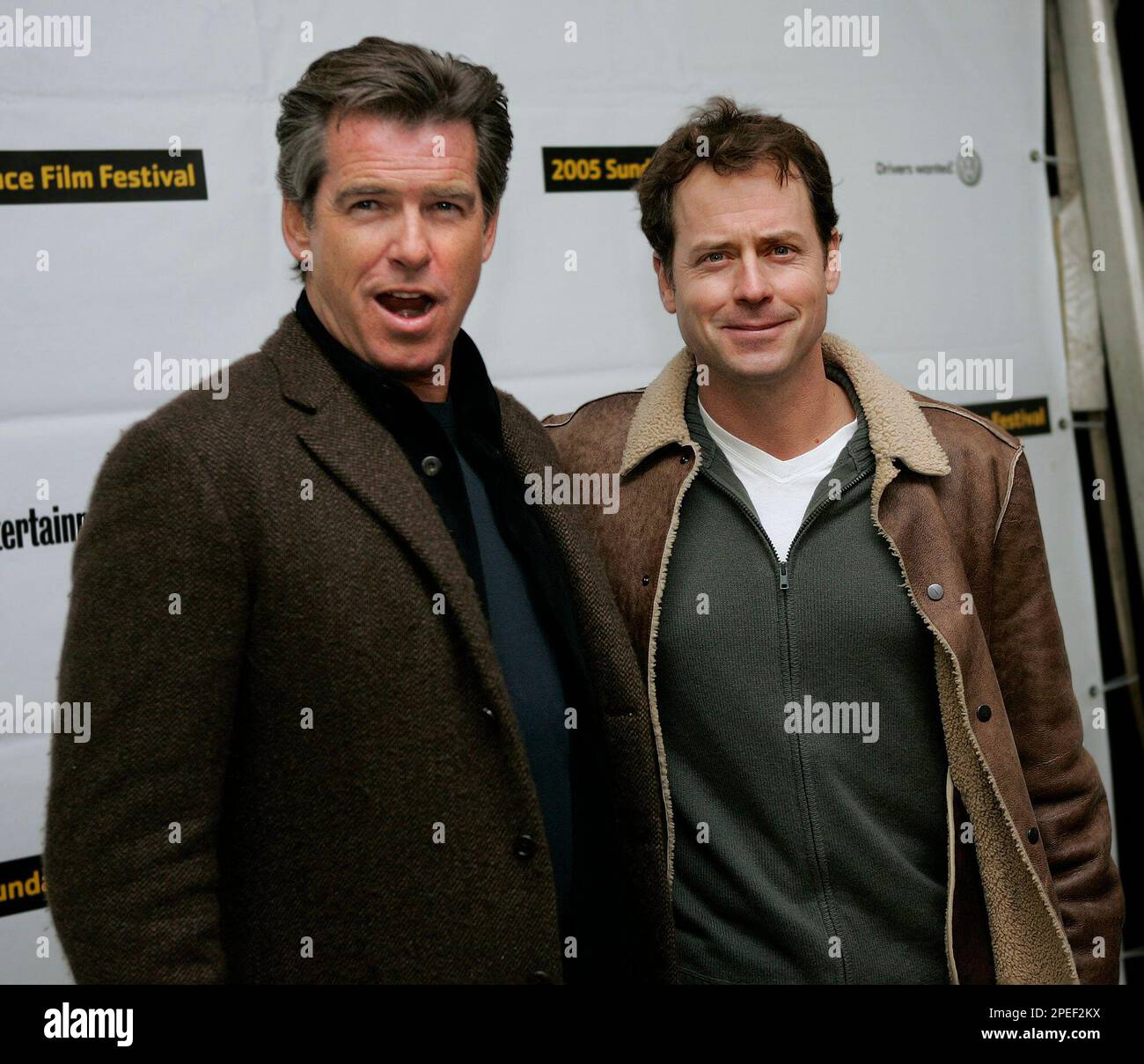 Actors Pierce Brosnan, left, and Greg Kinnear pose at the premier of