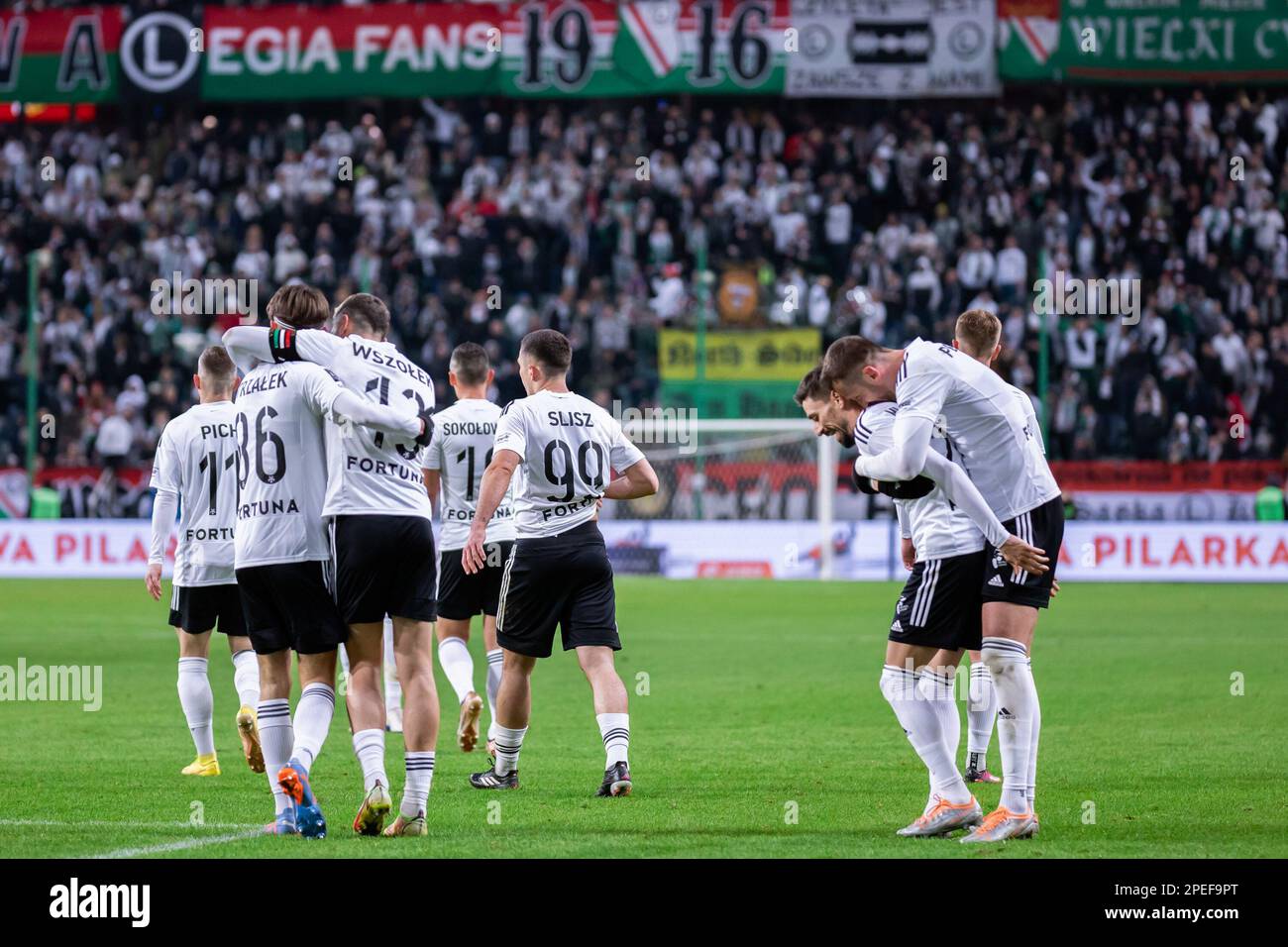 Warsaw, Poland. 12th Mar, 2023. Team of Legia celebrate a goal during