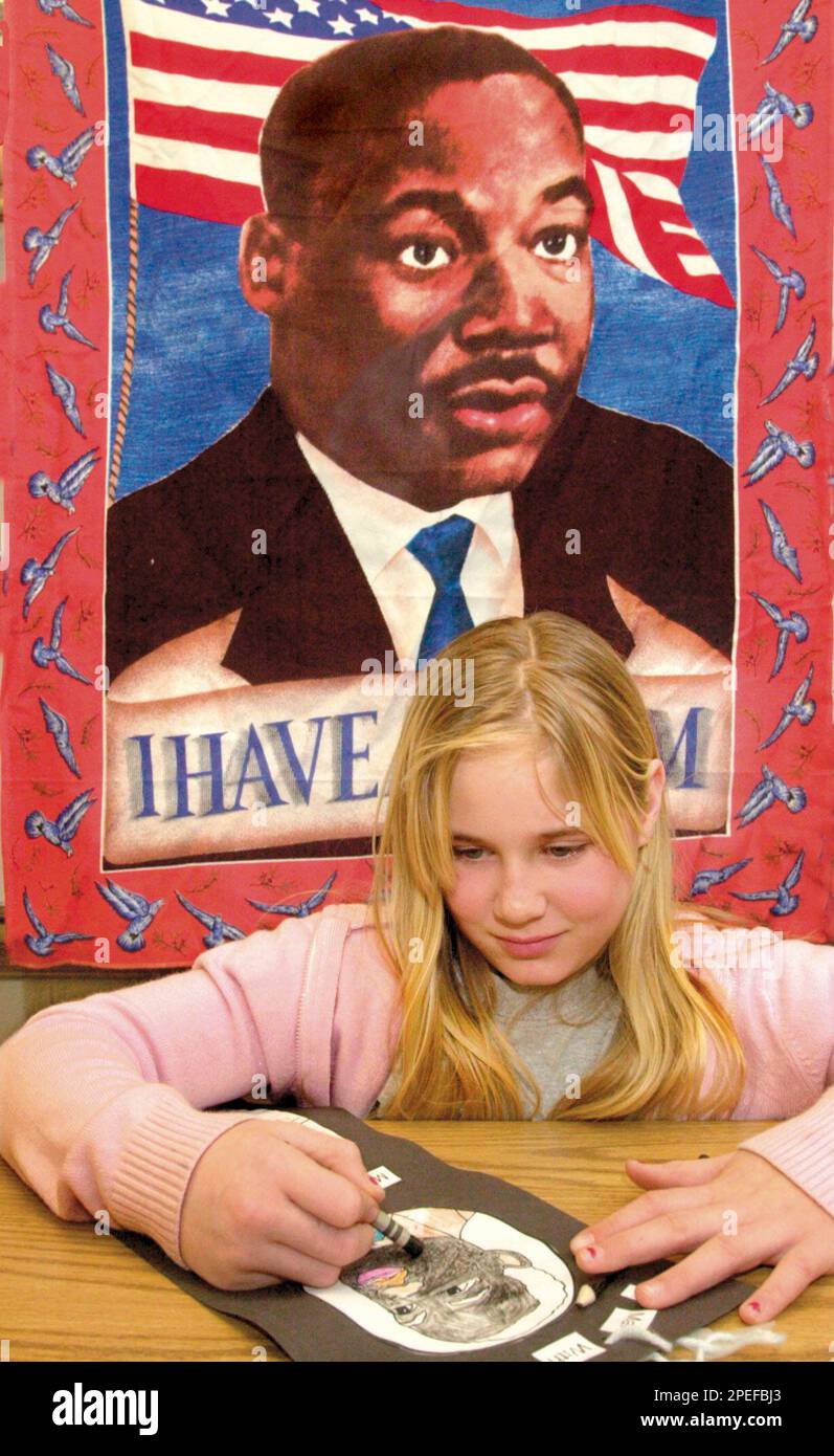Brittany Coble, 10, draws a picture of The Rev. Martin Luther King Jr