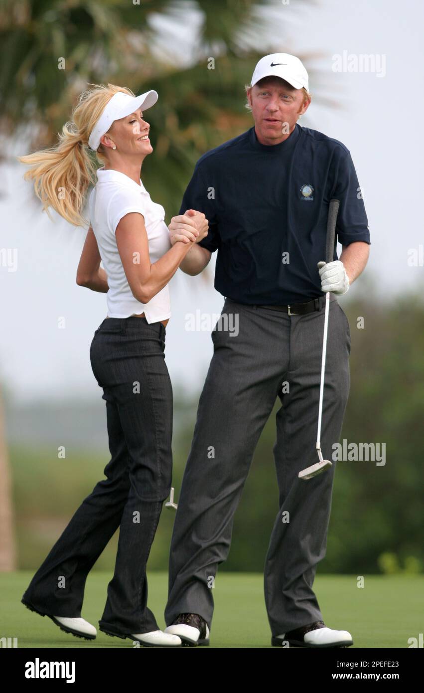 Tennis legend Boris Becker celebrates with Playboy playmate Lisa Dergan  after sinking a putt at the Ocean Club Golf Course during the Michael  Jordan Celebrity Invitational Sunday, Jan. 16, 2005. (AP Photo/Tim