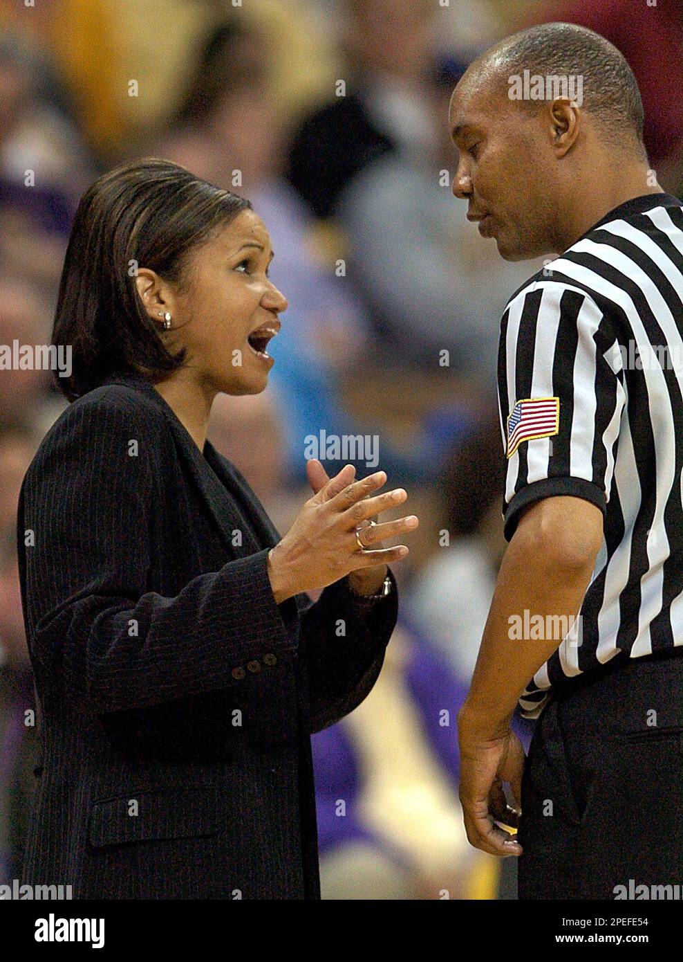 Louisiana State coach Pokey Chatman, left, discusses a call with