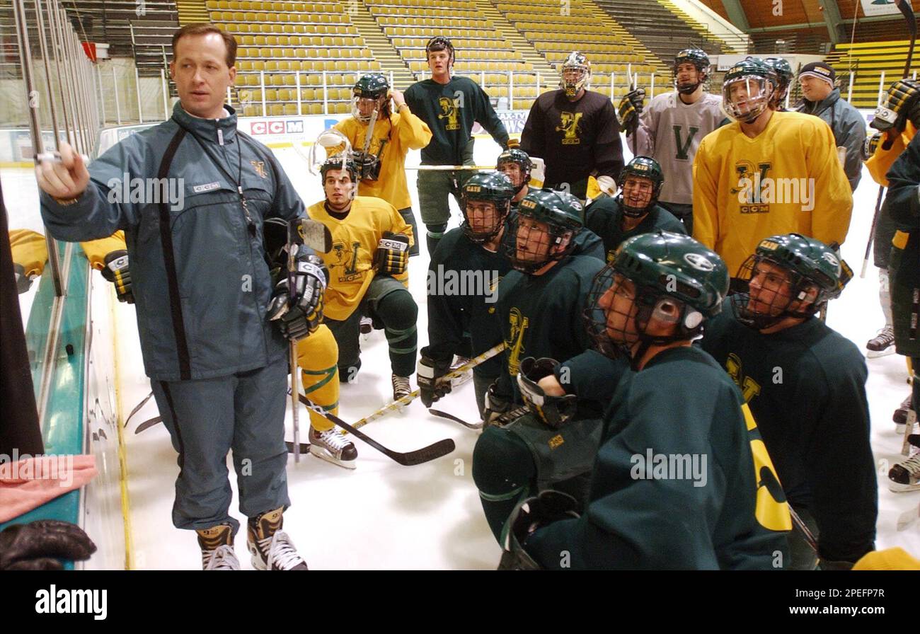 Vermont hockey coach Kevin Sneddon goes over a play with his team during practice in Burlington, Vt., Wednesday, Jan